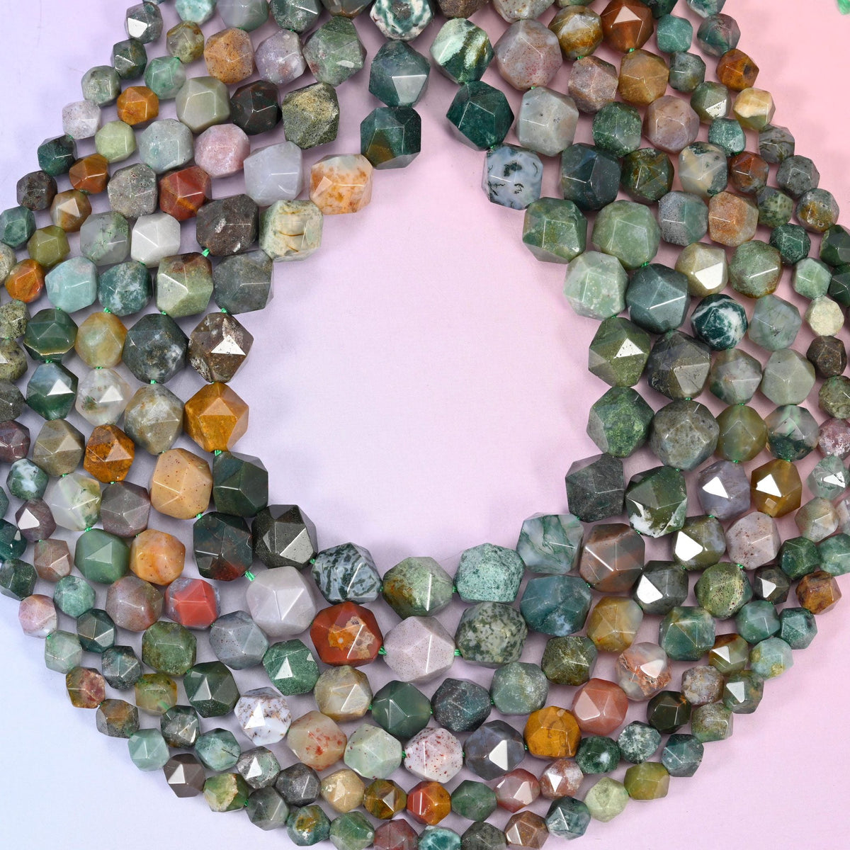 Indian Agate beads coiled into a loop, star facets catching light across mossy green, cream and amber stone