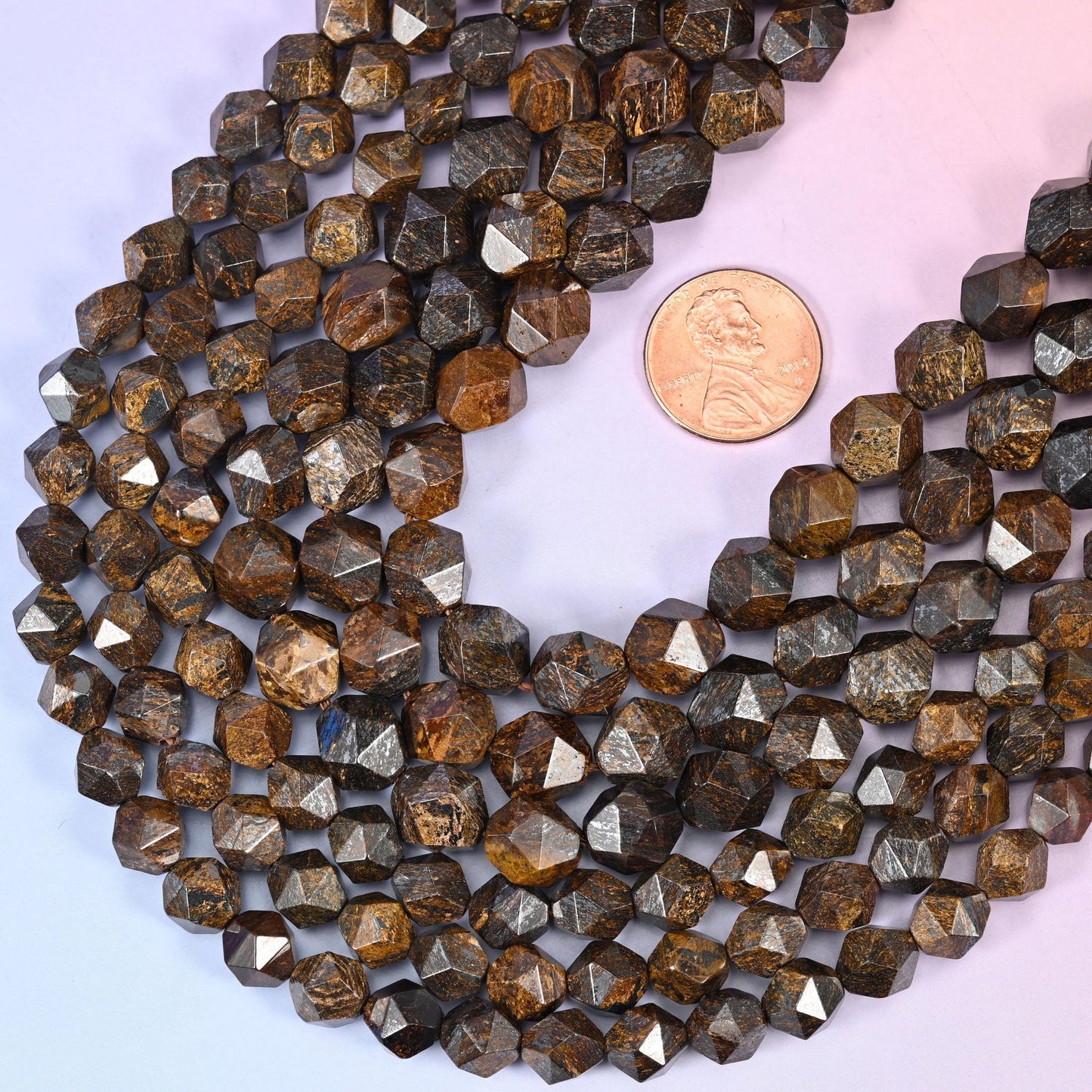 Faceted diamond star cut round cut bronzite beads