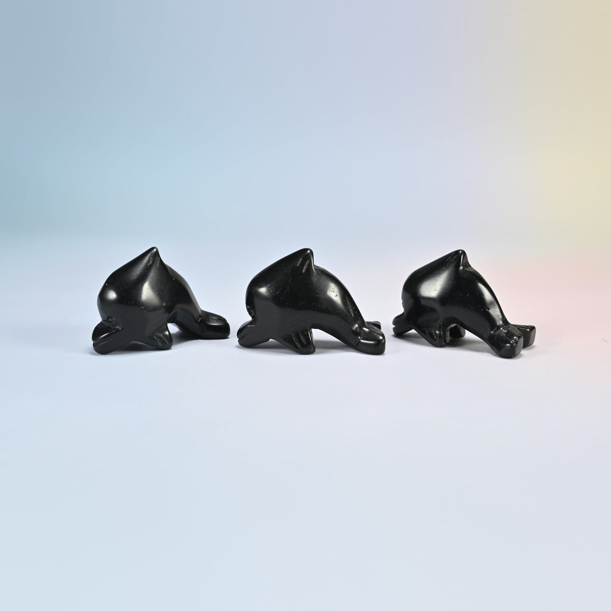 Three black obsidian dolphin crystal carvings, 2 inch, glossy black natural stone