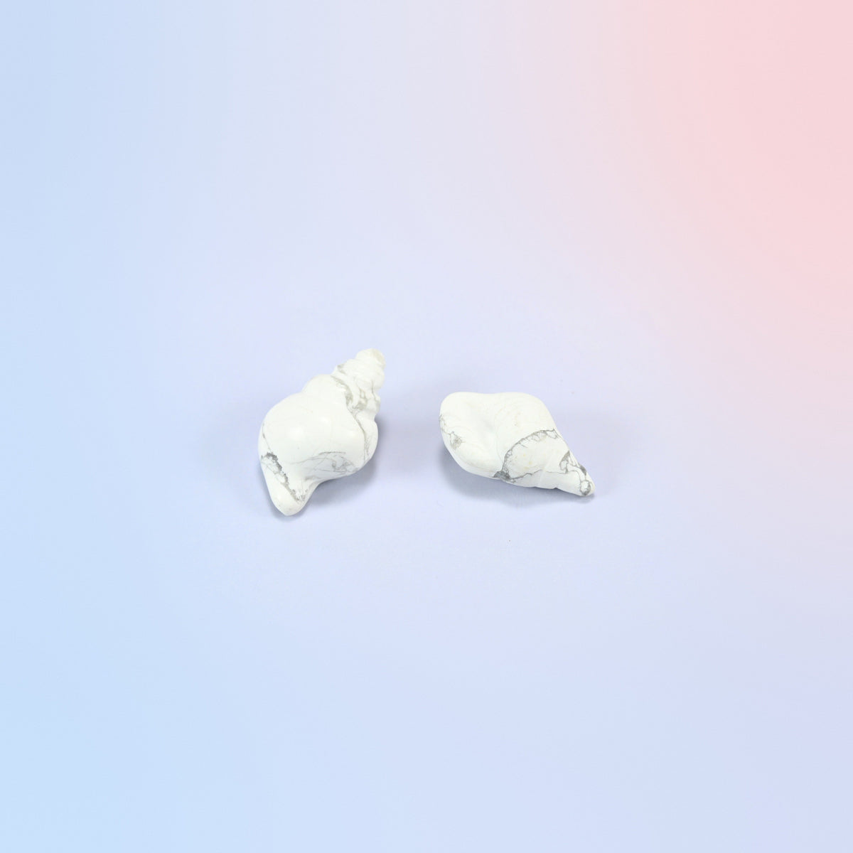 Two natural white howlite conch shell crystal carvings, 1.5 inch, white with gray veining