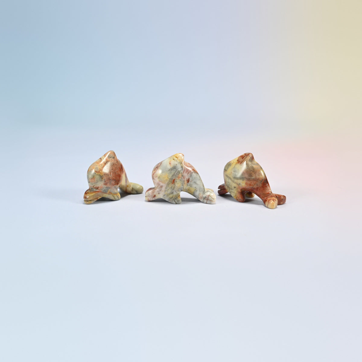 Three crazy agate dolphin crystal carvings, 1.5 inch, cream, tan and red natural stone
