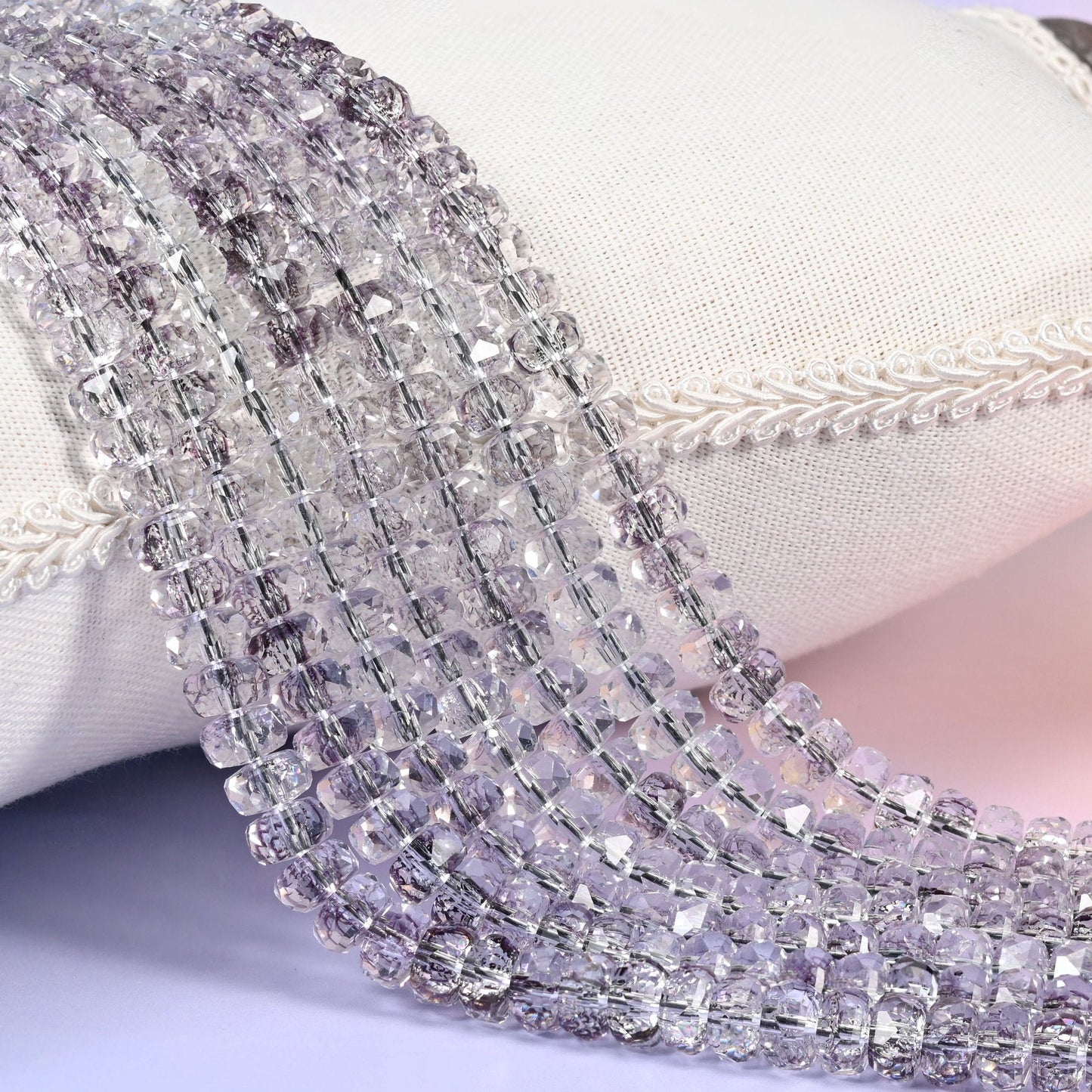 Transparent light purple faceted rondelle glass beads in the palest smoky lilac