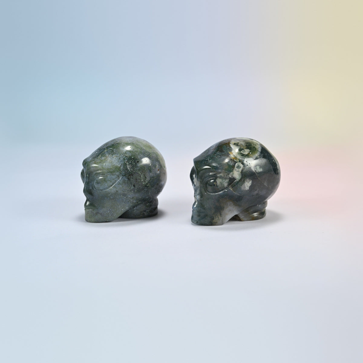 Two moss agate alien head crystal carvings, 2 inch, dark green and white natural stone