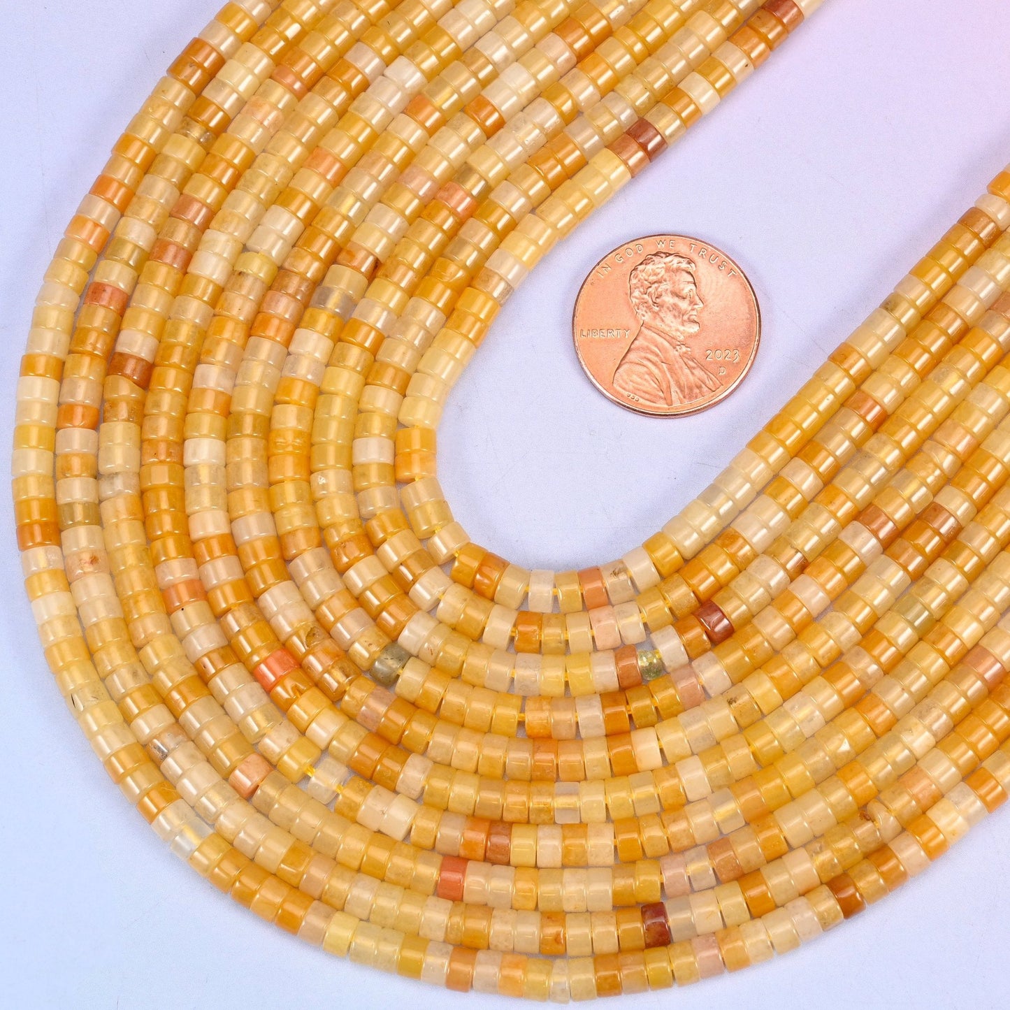 Smooth heishi disc cut Yellow Jade beads