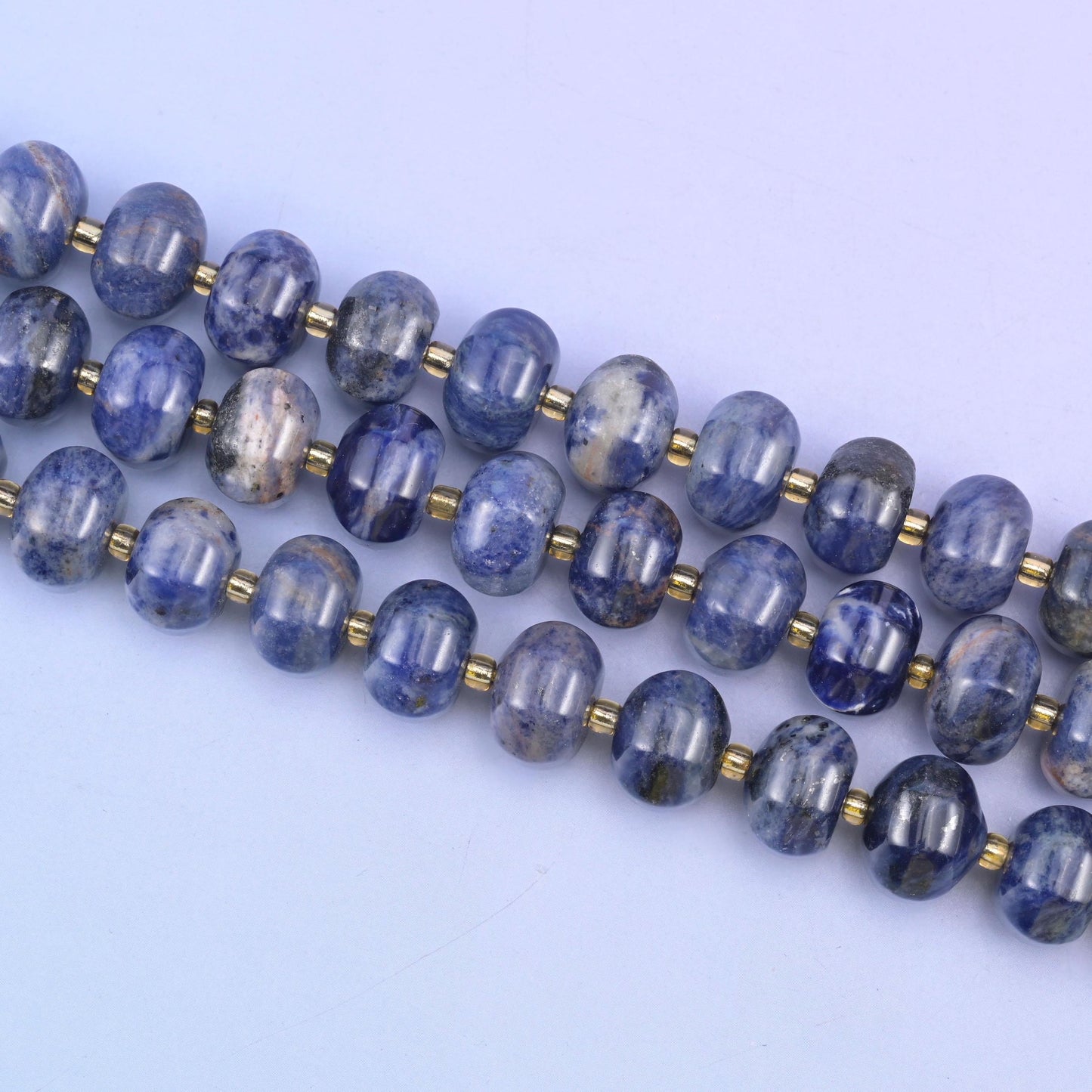 Sodalite beads in deep indigo-blue with white and gray veining
