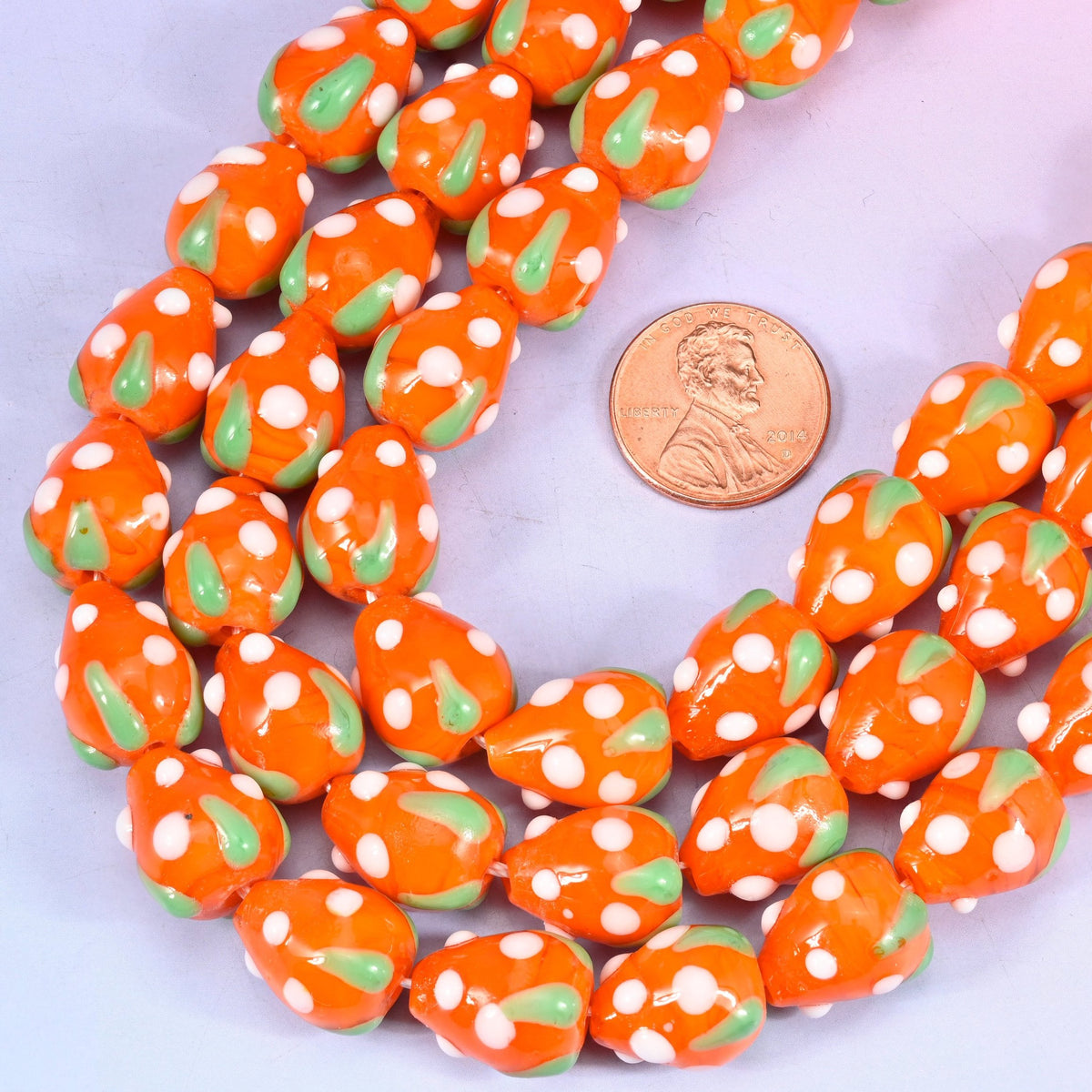 Strawberry shaped lampwork glass beads with white seed dots