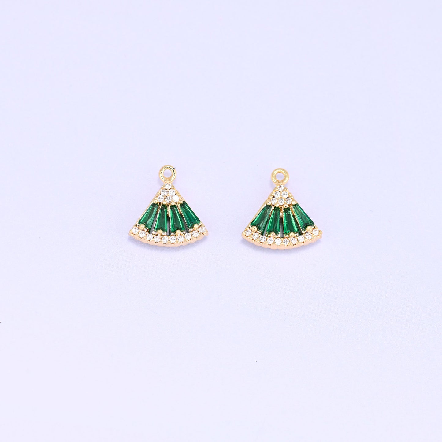 Small gold charms, two green fan charms facing forward