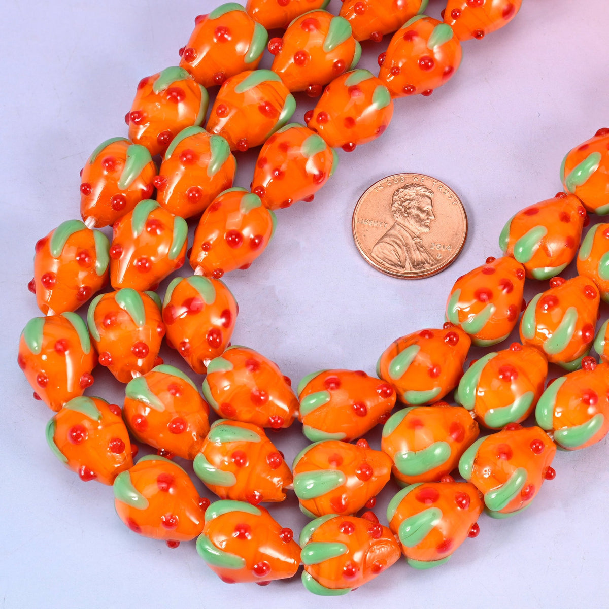 Lampwork strawberry shaped orange glass beads