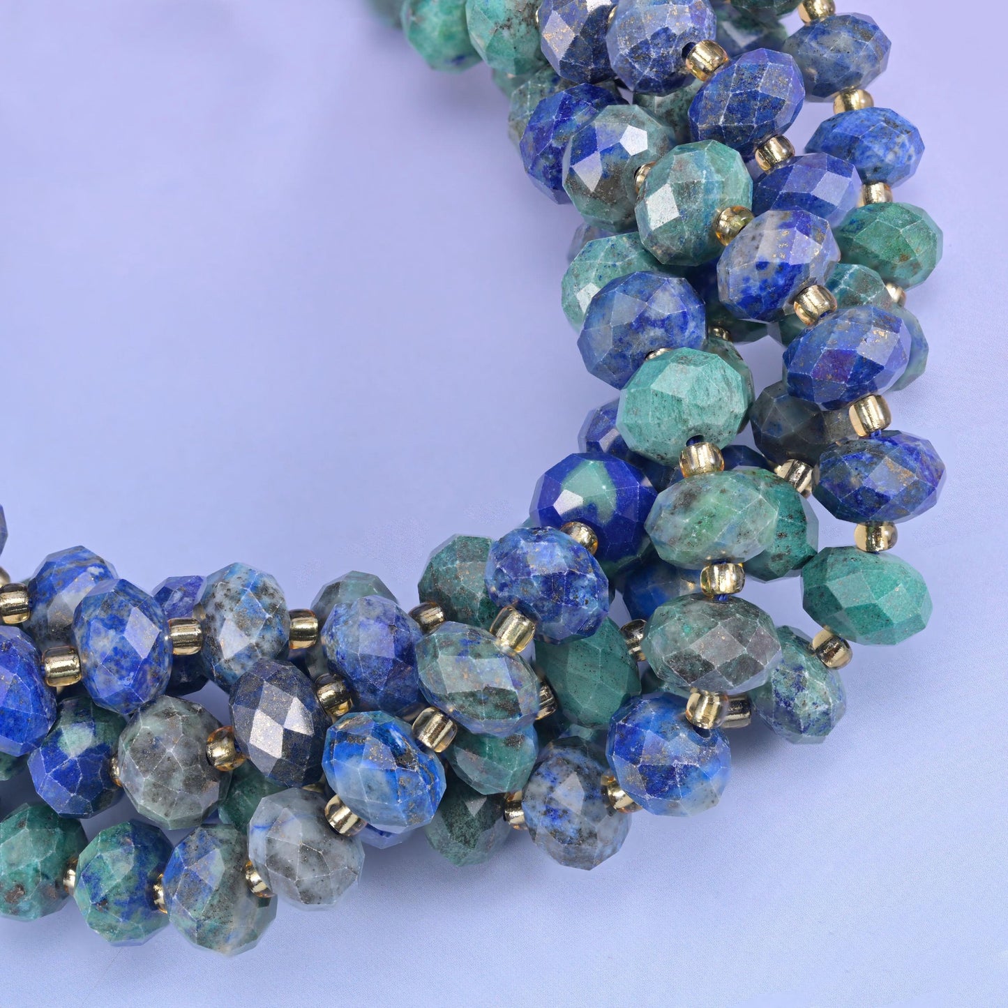 Faceted rondelle cut phoenix lapis beads