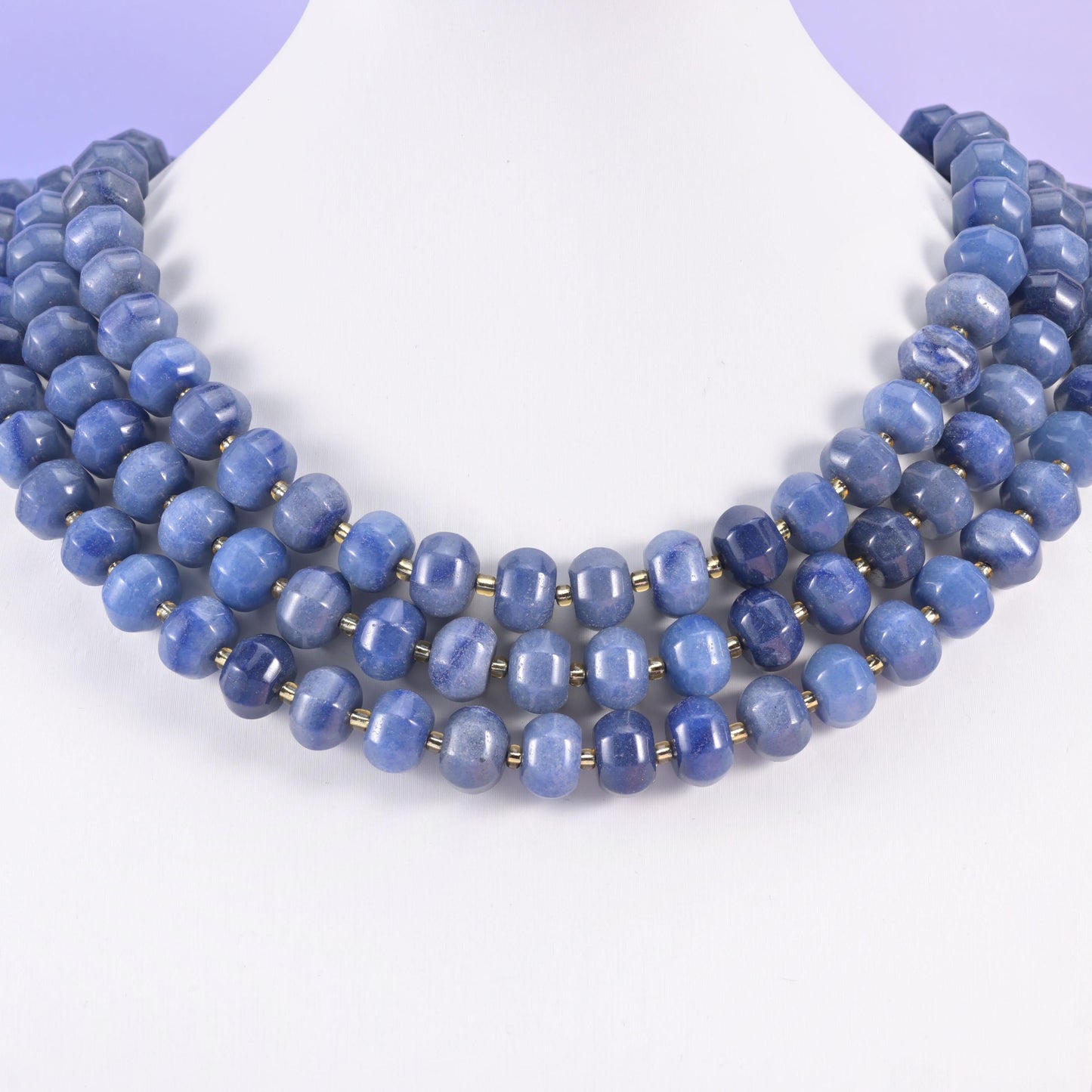 White display bust wearing the strands as a short collar, showing the drape of 12x8mm rondelles