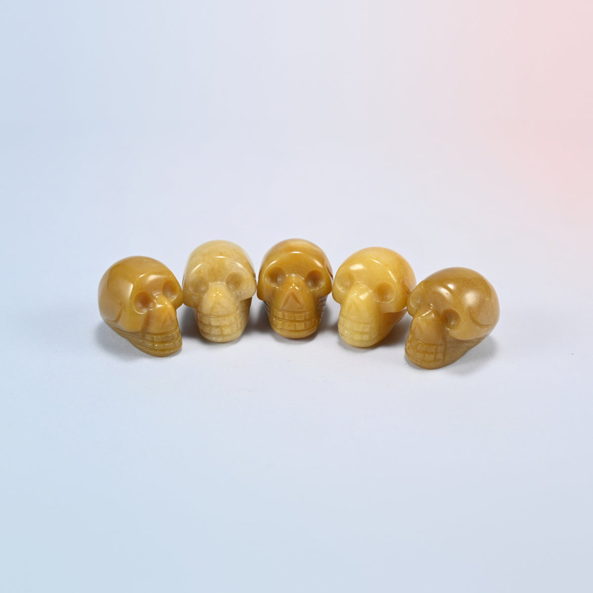 1 inch skull crystal carving in yellow jade, soft yellow natural stone