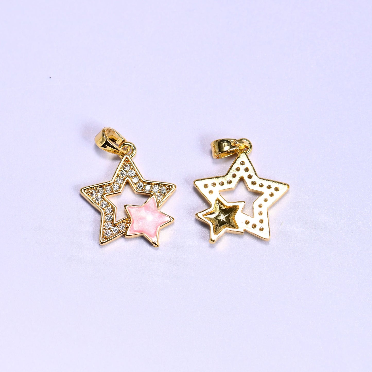 Double star charm with a shell inner star and zircon pave outer star