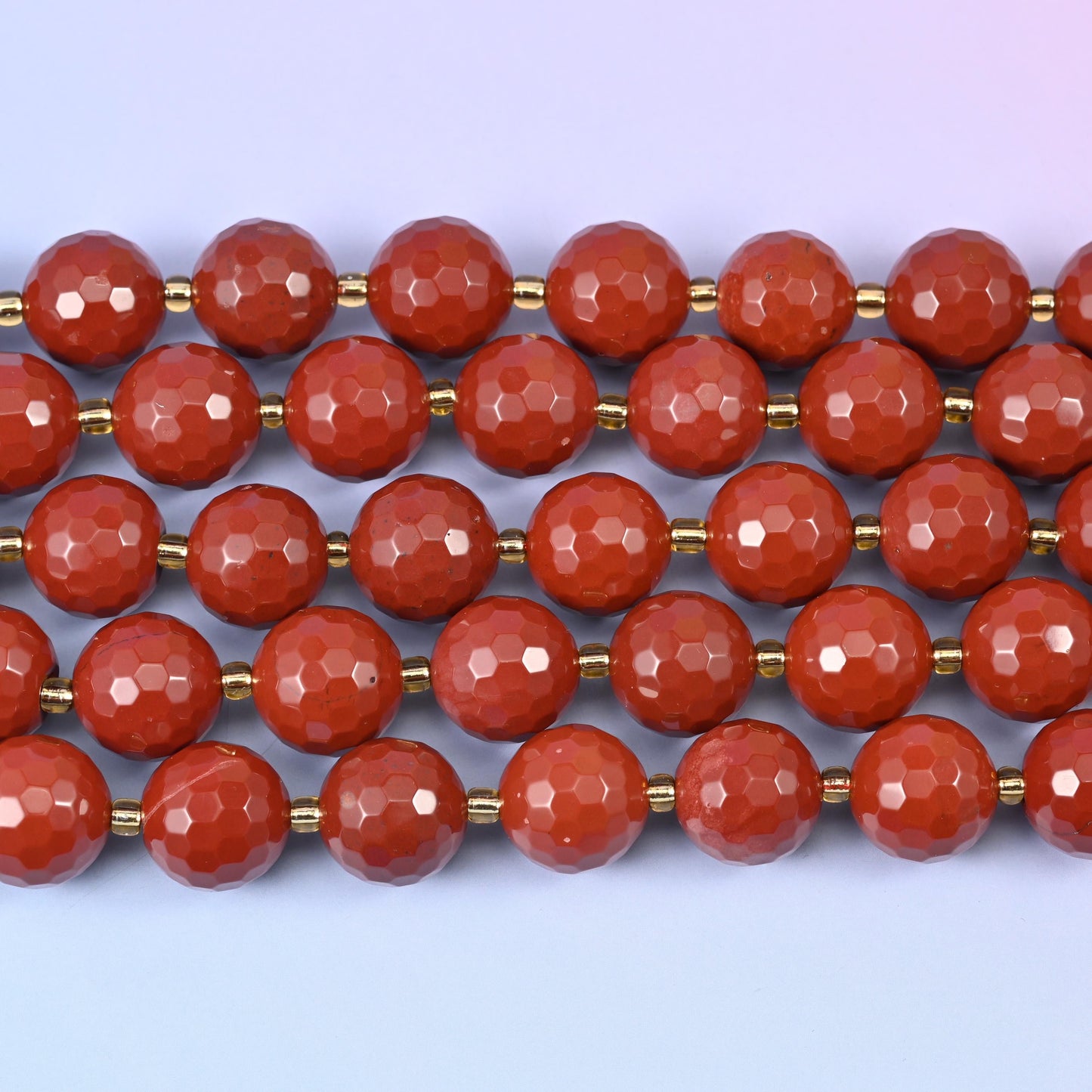 Red Jasper in matte-soft terracotta with tiny bright facet highlights