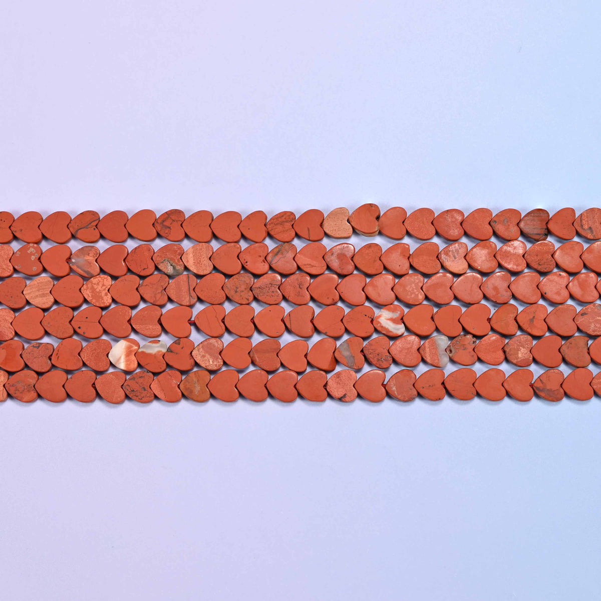 Red jasper beads in warm brick and terracotta red