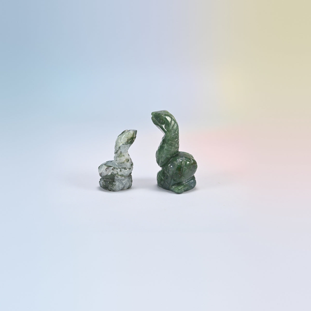 Cobra snake crystal carving in moss agate, white and green natural stone