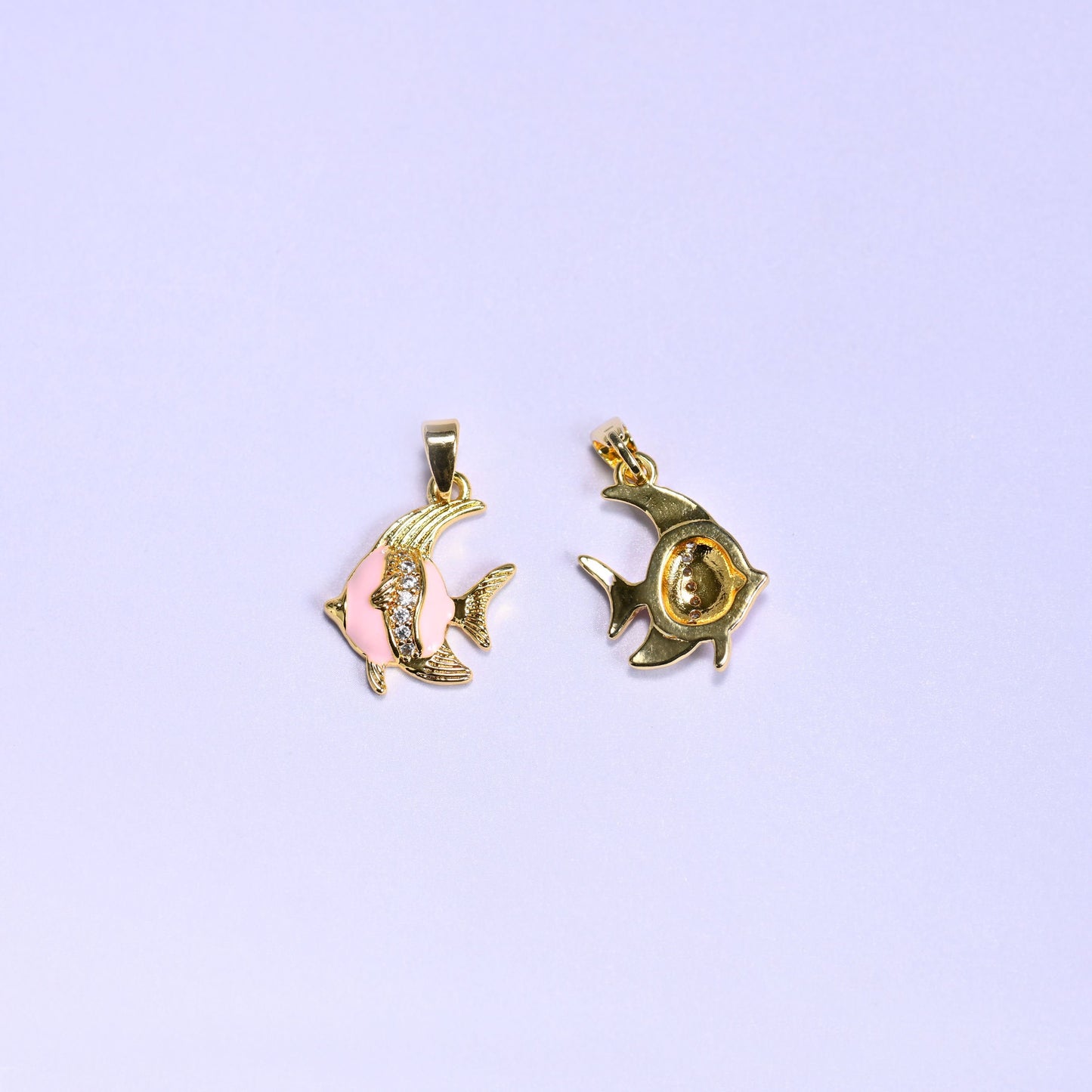 Tropical fish charm with an enamel body and gold fin and tail details