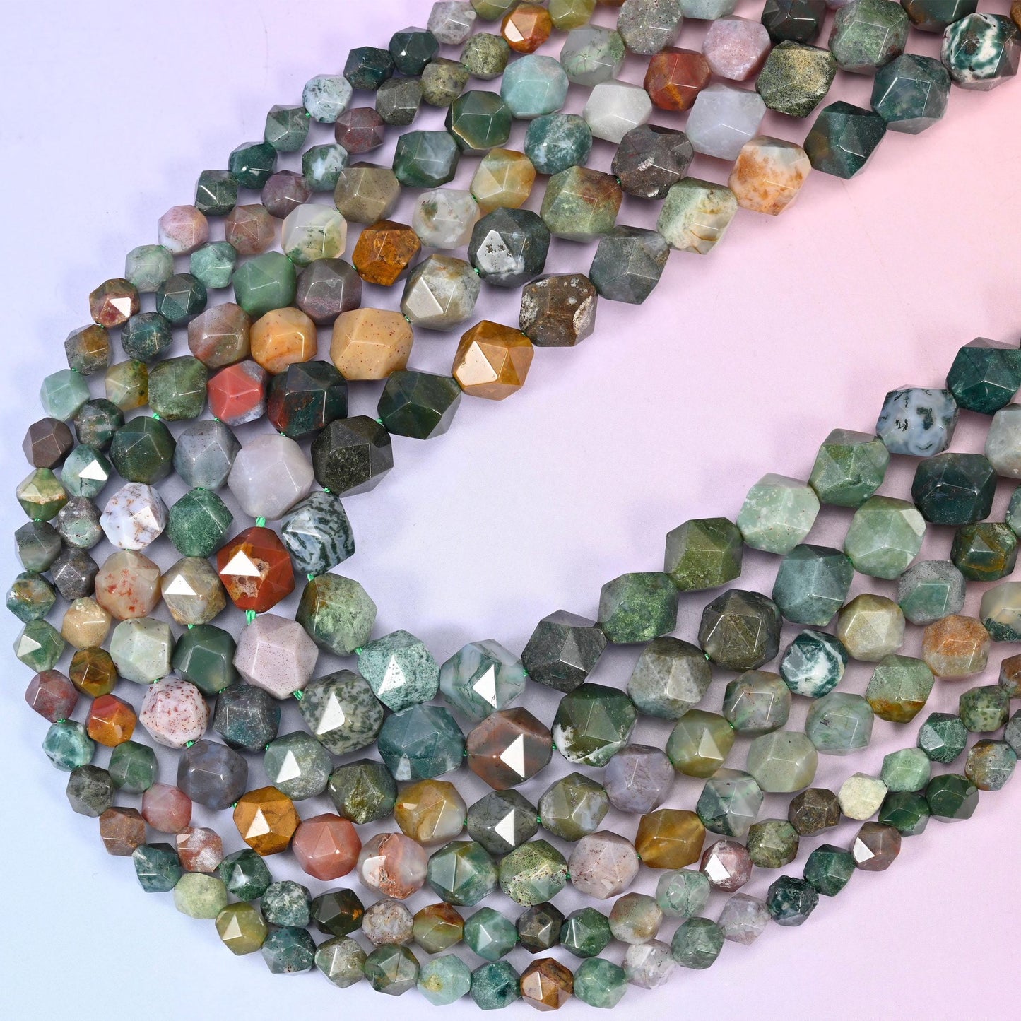 Indian Agate diamond star cut beads, strands crossing in a V, natural banded stone with the pattern shifting bead to bead