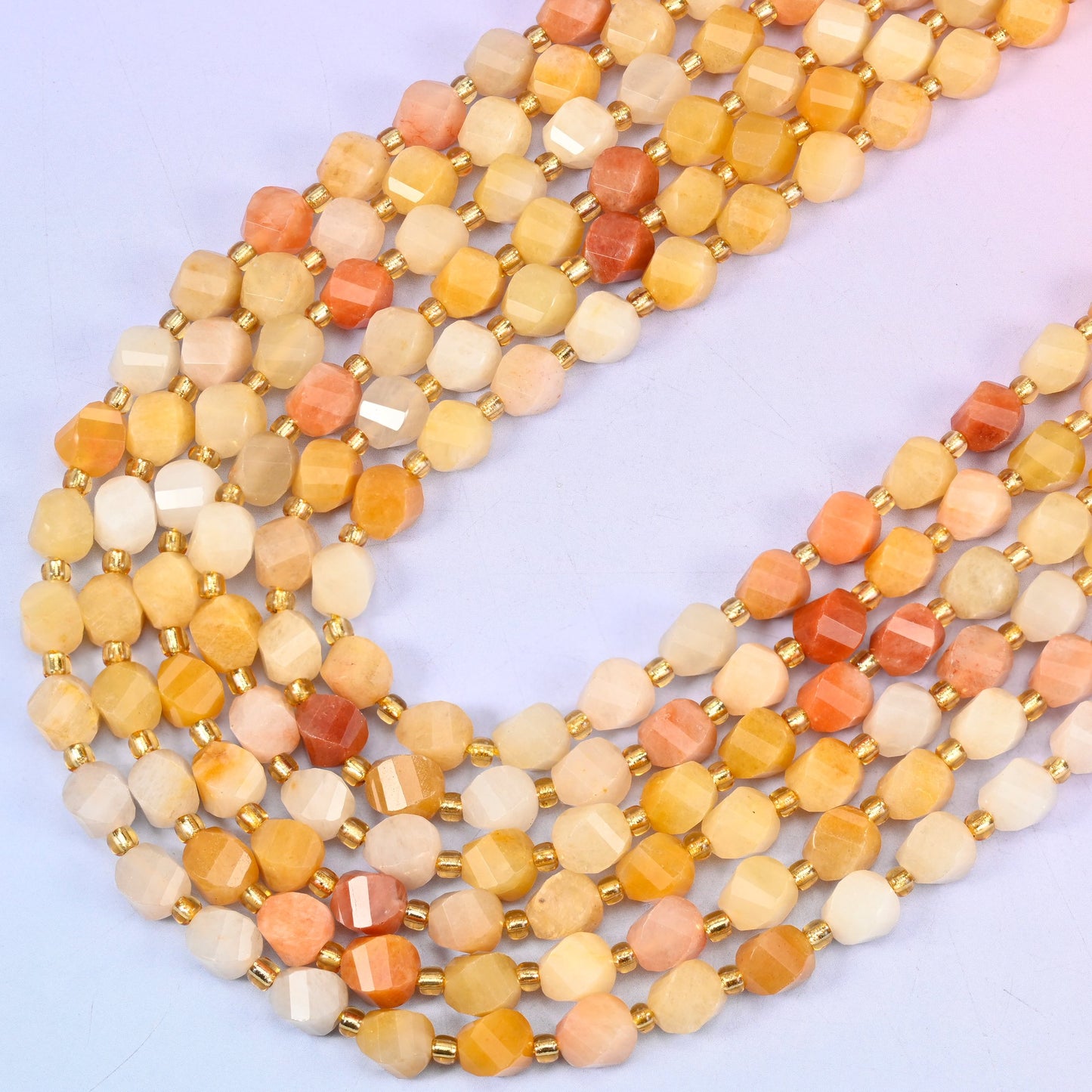 Gold silk jade yellow jade beads, eight-sided spiral twist cut catching light on every facet, 8mm