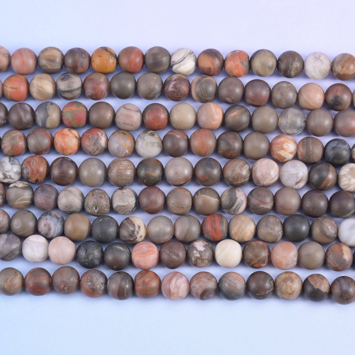 Mushroom brown, taupe and salmon-streaked rounds still showing the grain of the wood they came from