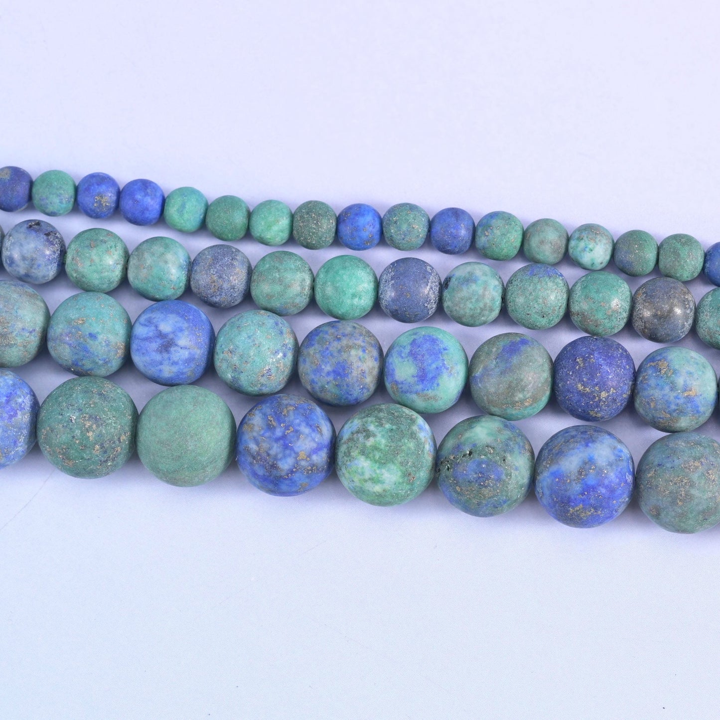 Phoenix lapis round beads in sea green and turquoise with royal blue blotching