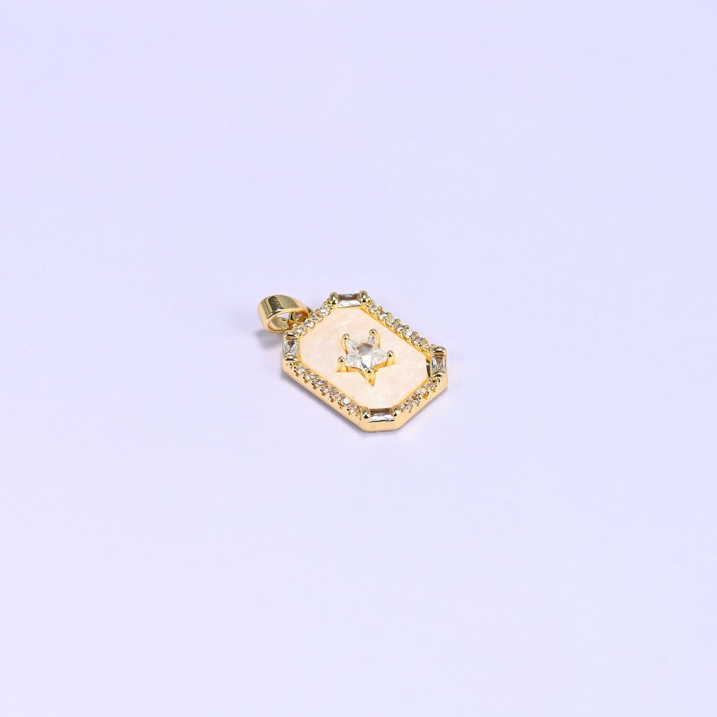 Star frame charm with a baguette and round zircon border