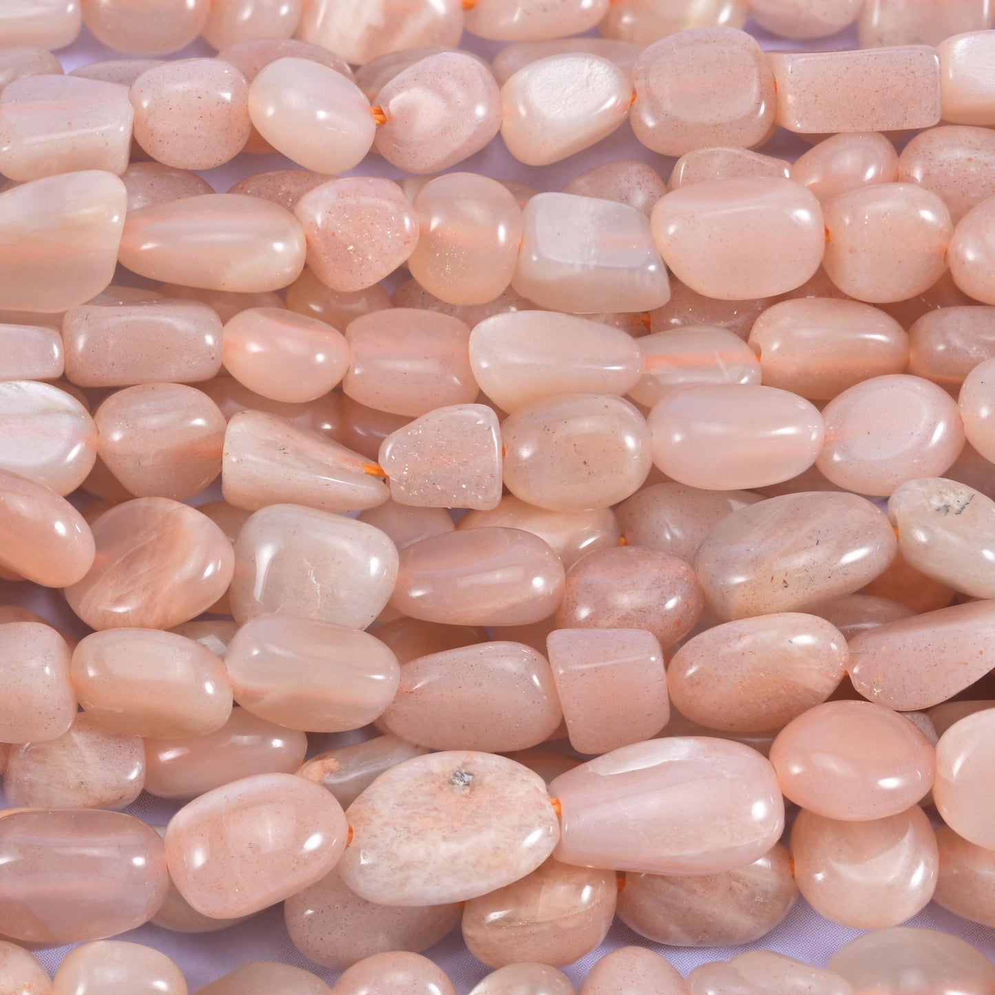 Peach moonstone pebble nugget beads, approximately 55 beads per strand