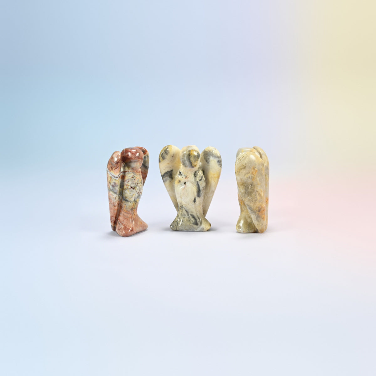 Three natural crazy agate guardian angel carvings, cream with red-brown and gray patterns, 2 inch
