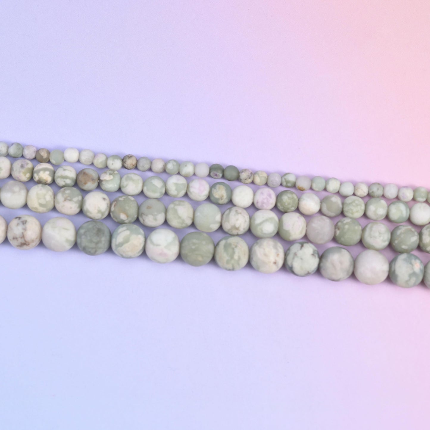 Peace Jasper round beads in pale sage green with grey-brown veining