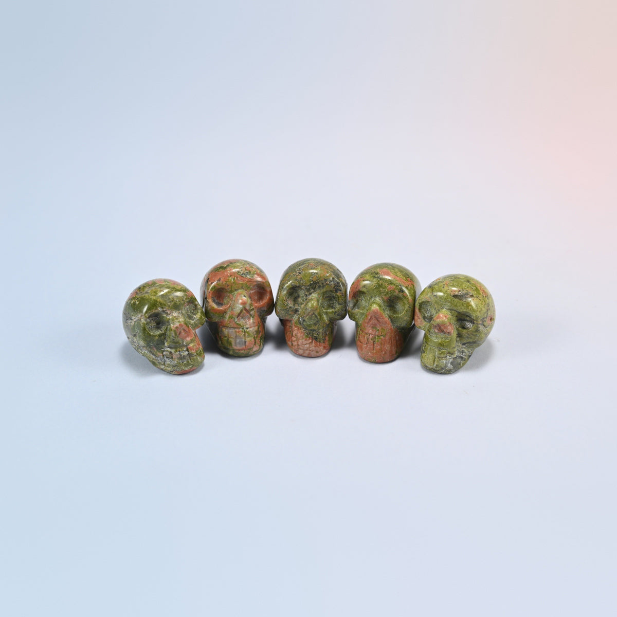 1 inch skull crystal carving in unakite, green and salmon pink natural stone