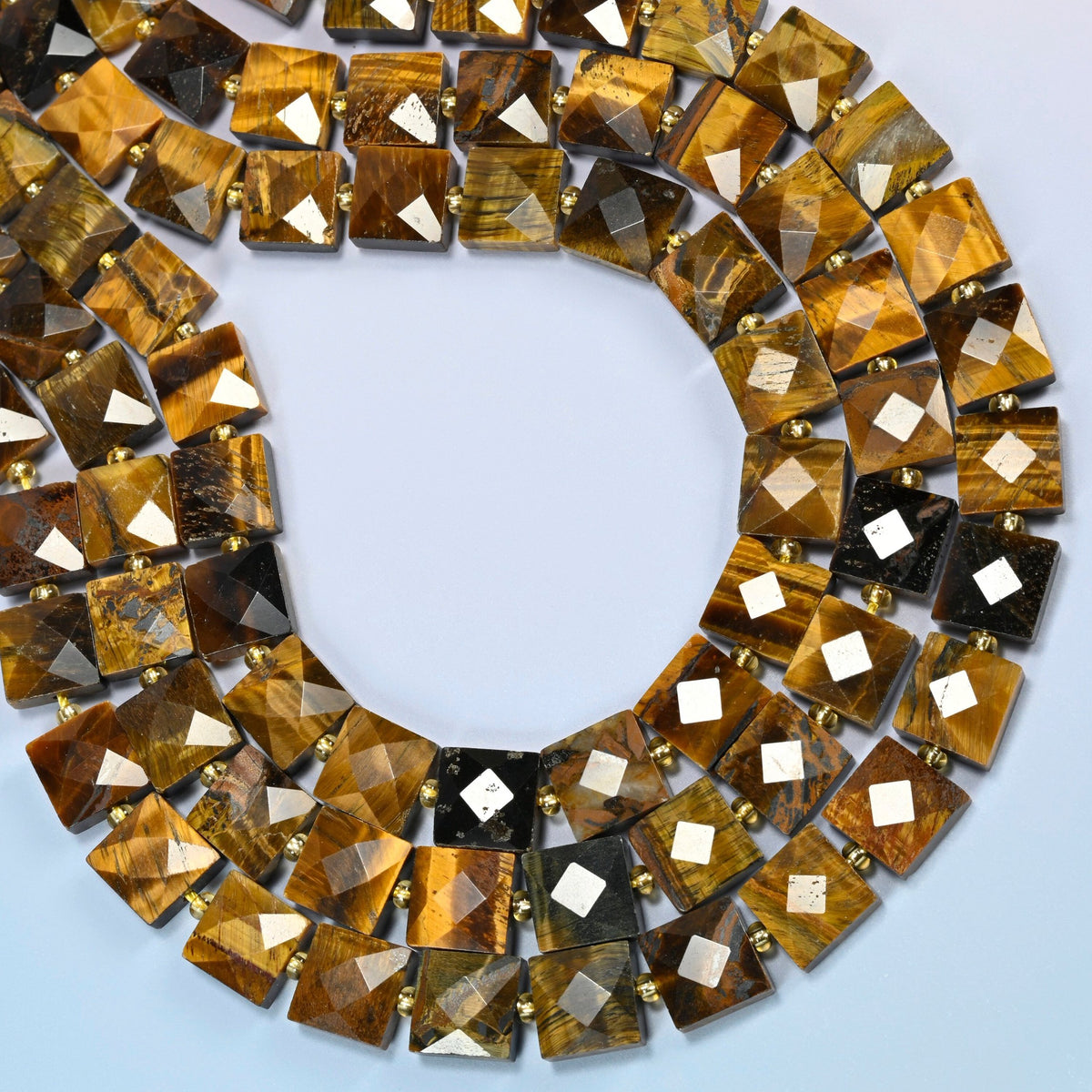 Natural tiger eye faceted flat square beads curved into an open loop, golden brown and dark brown beads