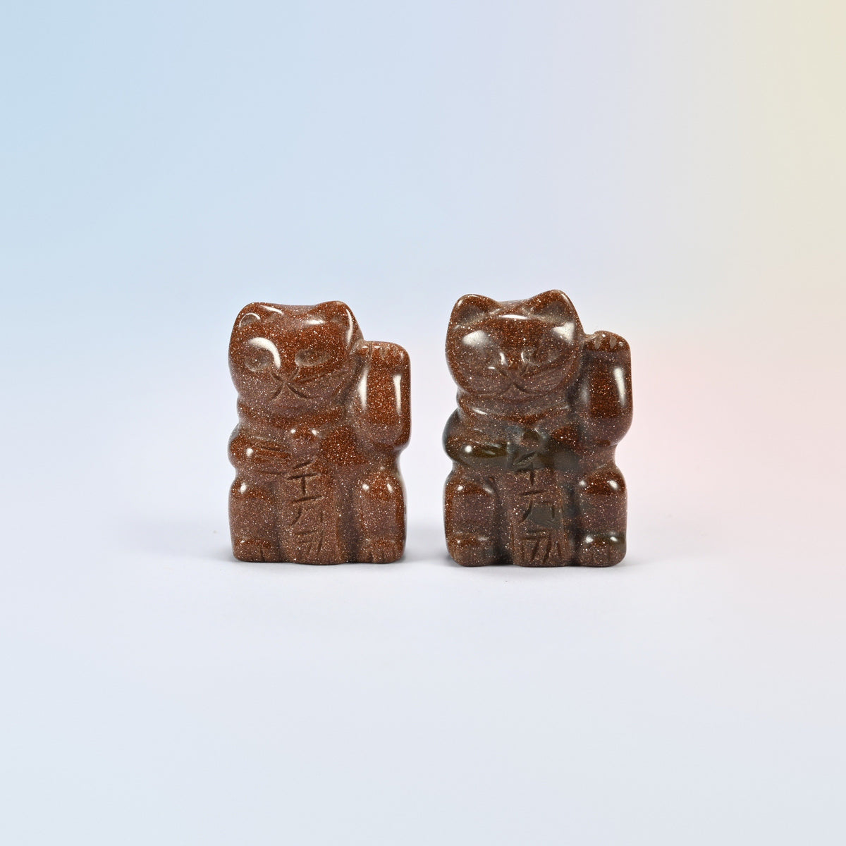 Two gold sandstone lucky cat carvings, 1.5 inch, sparkly brown man-made glass