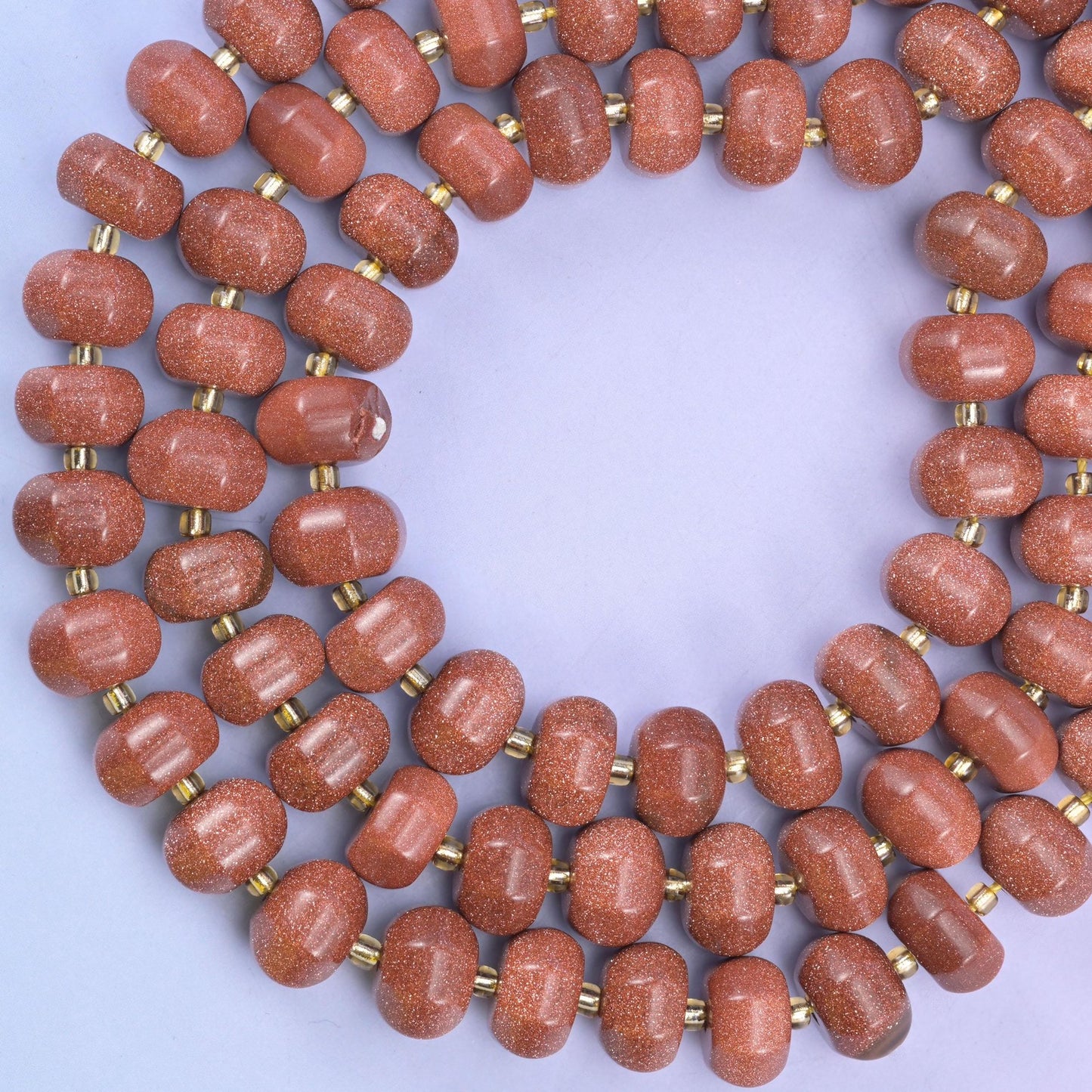 Gold sandstone pumpkin beads, approximately 35 beads per strand