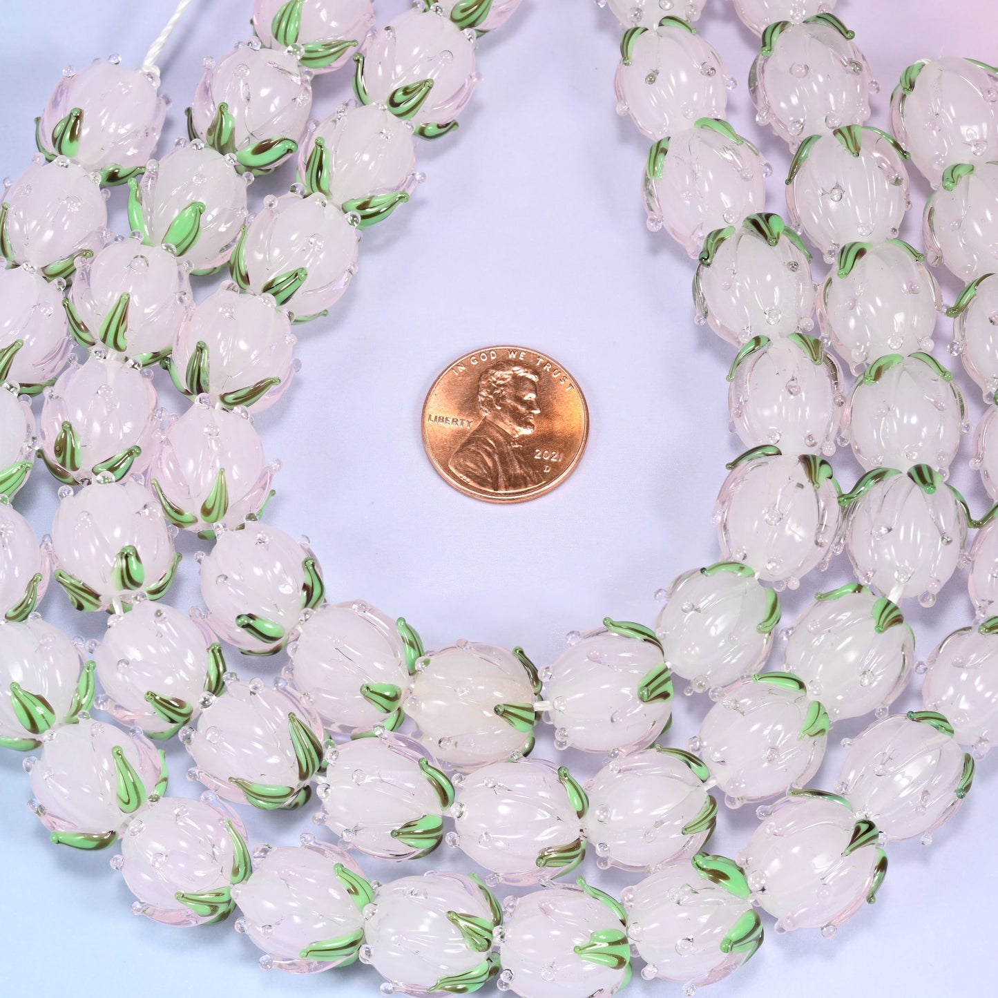 Light pink tulip flower bud lampwork glass beads, approximately 20 beads per strand