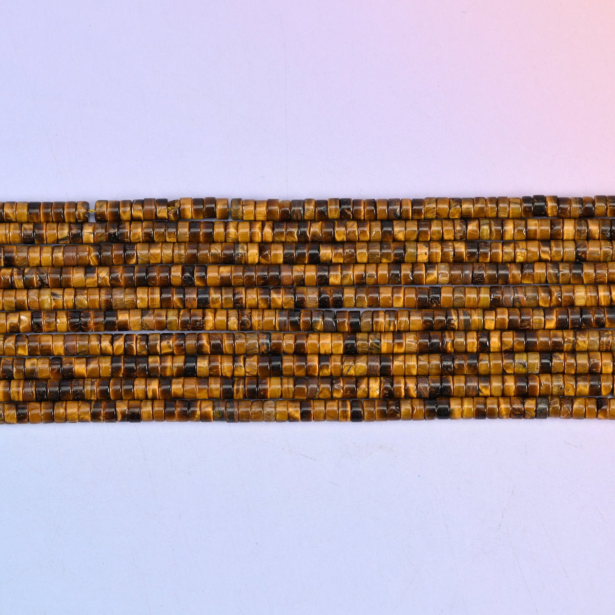 Tiger Eye Smooth Heishi Disc Beads in warm golden brown