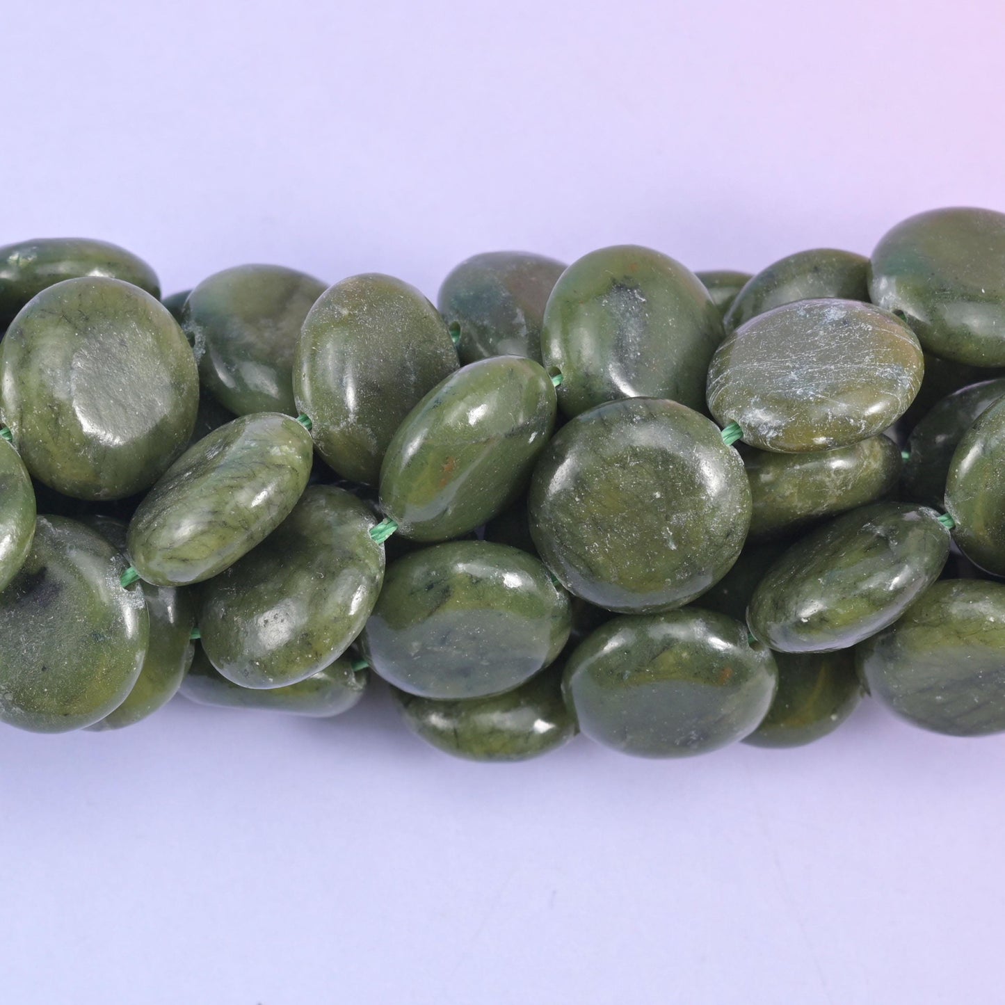 Coin cut South Green Jade beads with a smooth polished finish