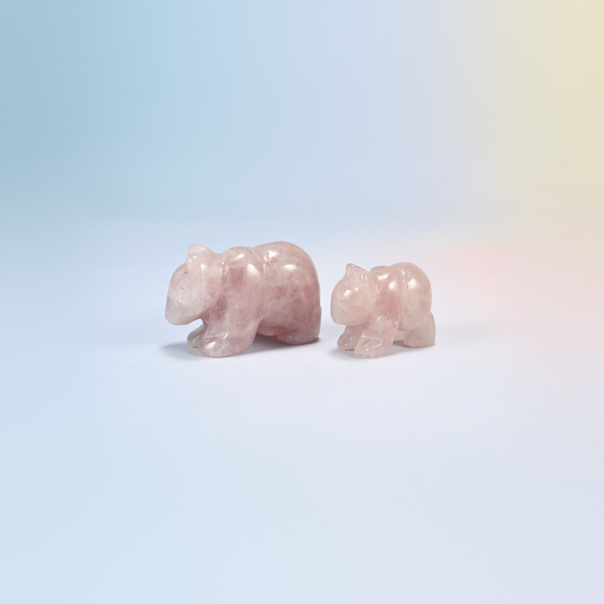 A 2 inch and a 1.5 inch rose quartz bear crystal carving, light pink natural stone