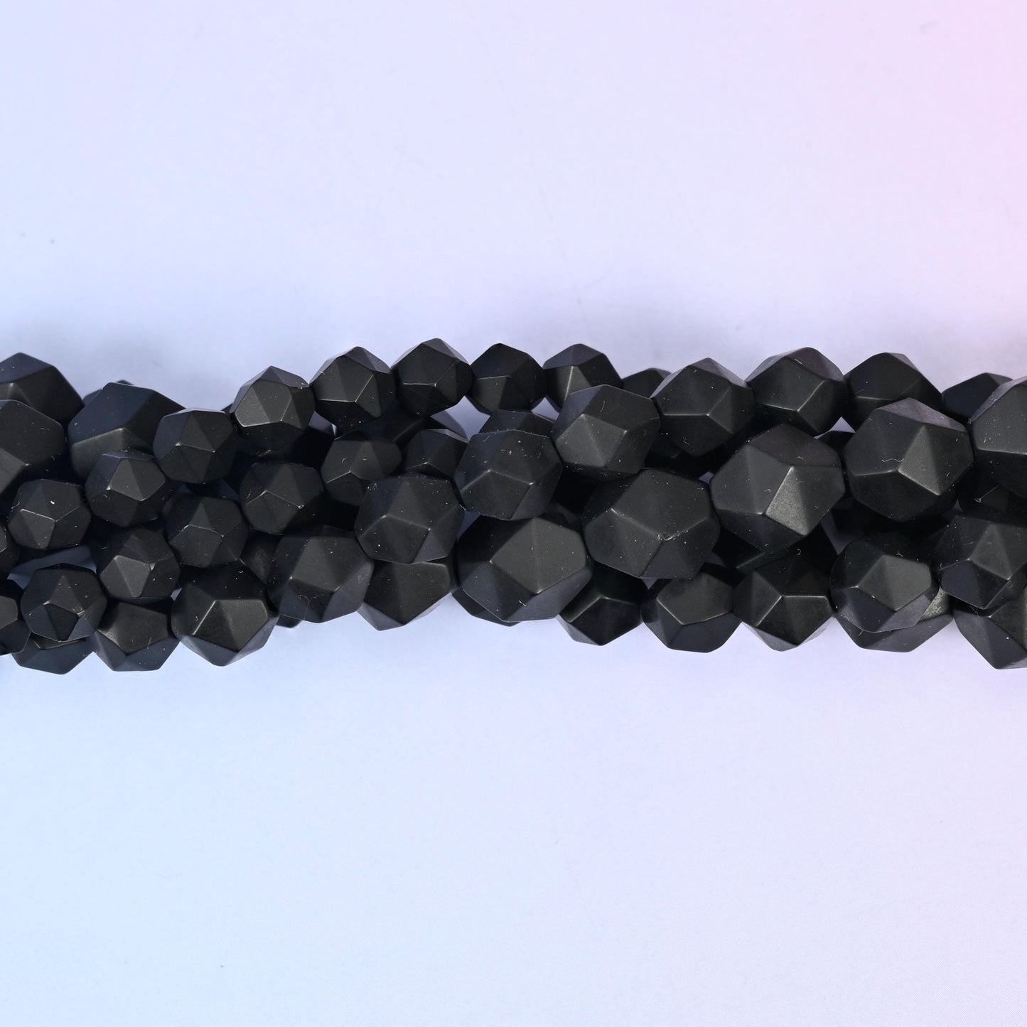 Natural Black Onyx gemstone beads with a matte frosted faceted star cut