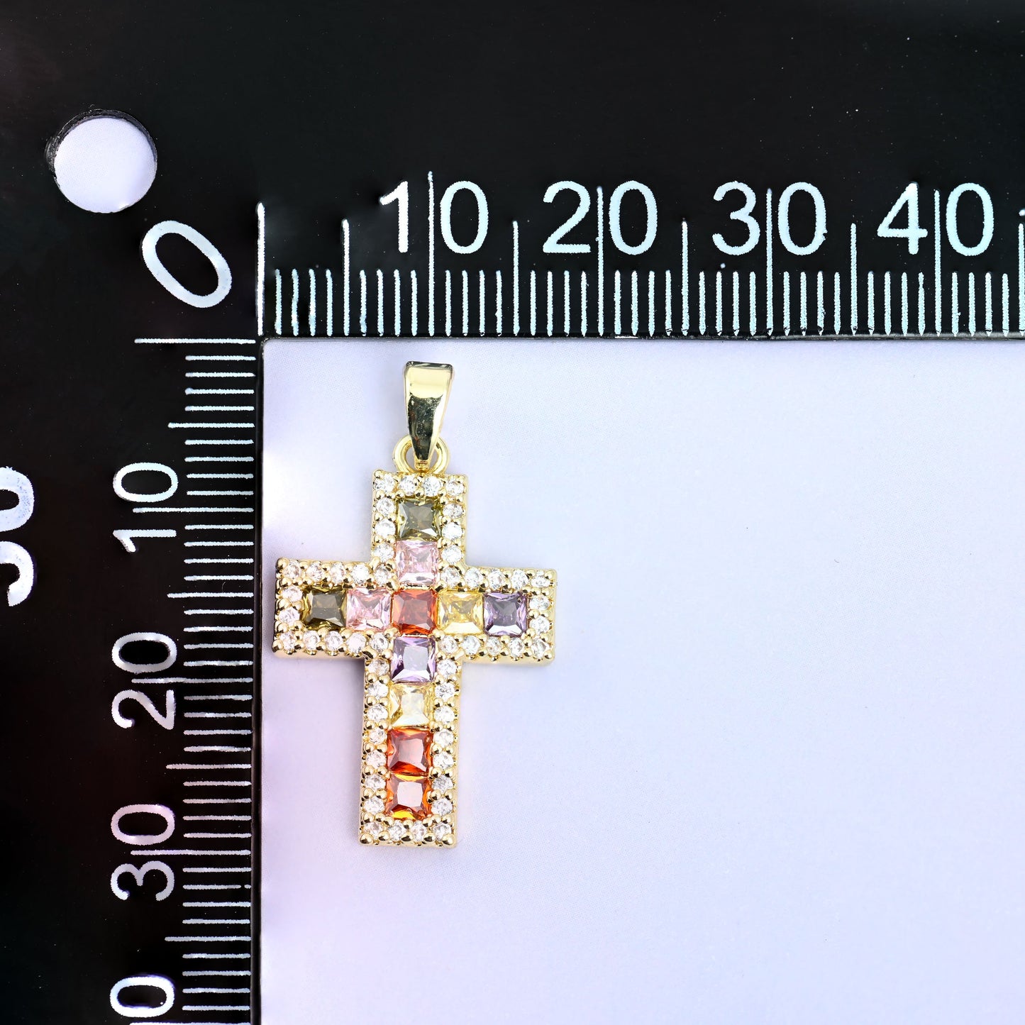 Zirconia cross charm measured at 24.15mm tall including the ring
