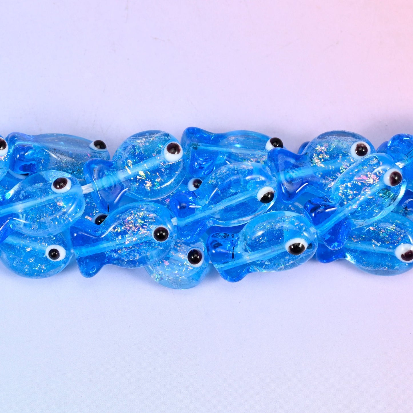 Blue Fish Glass Beads, translucent cornflower blue fish with a hand-painted black and white eye