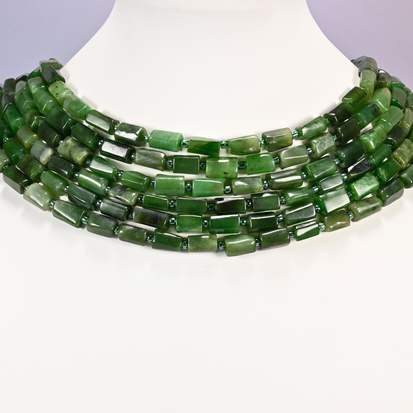 Canadian Green Jade faceted tube beads laid in four graduated collar rows, 8x7mm to 12x7mm deep green tubes with lighter sage banding