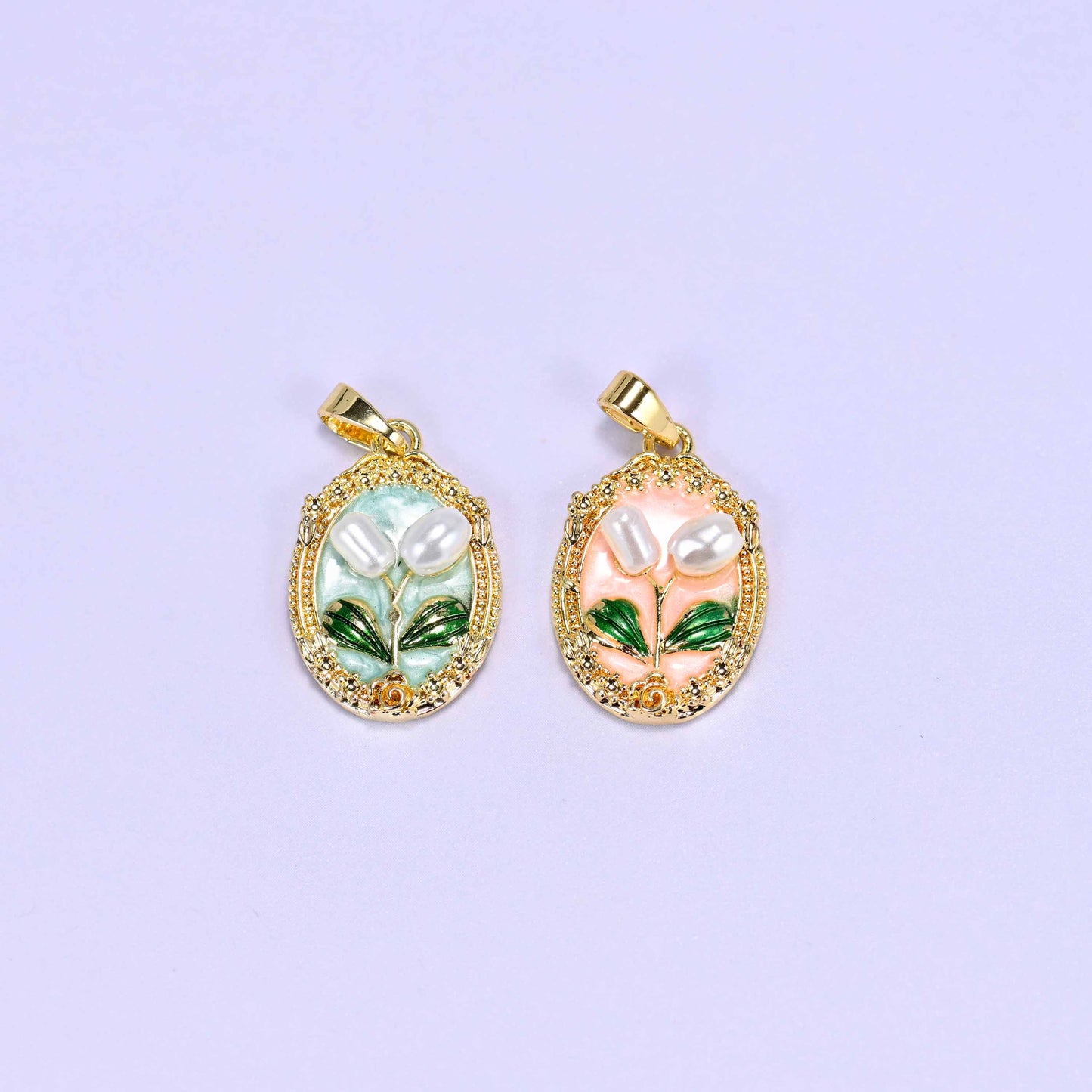 Enamel Oval Tulip Flower Pendants shown as both colours together, mint on the left and peach on the right, each with a small gold bail.