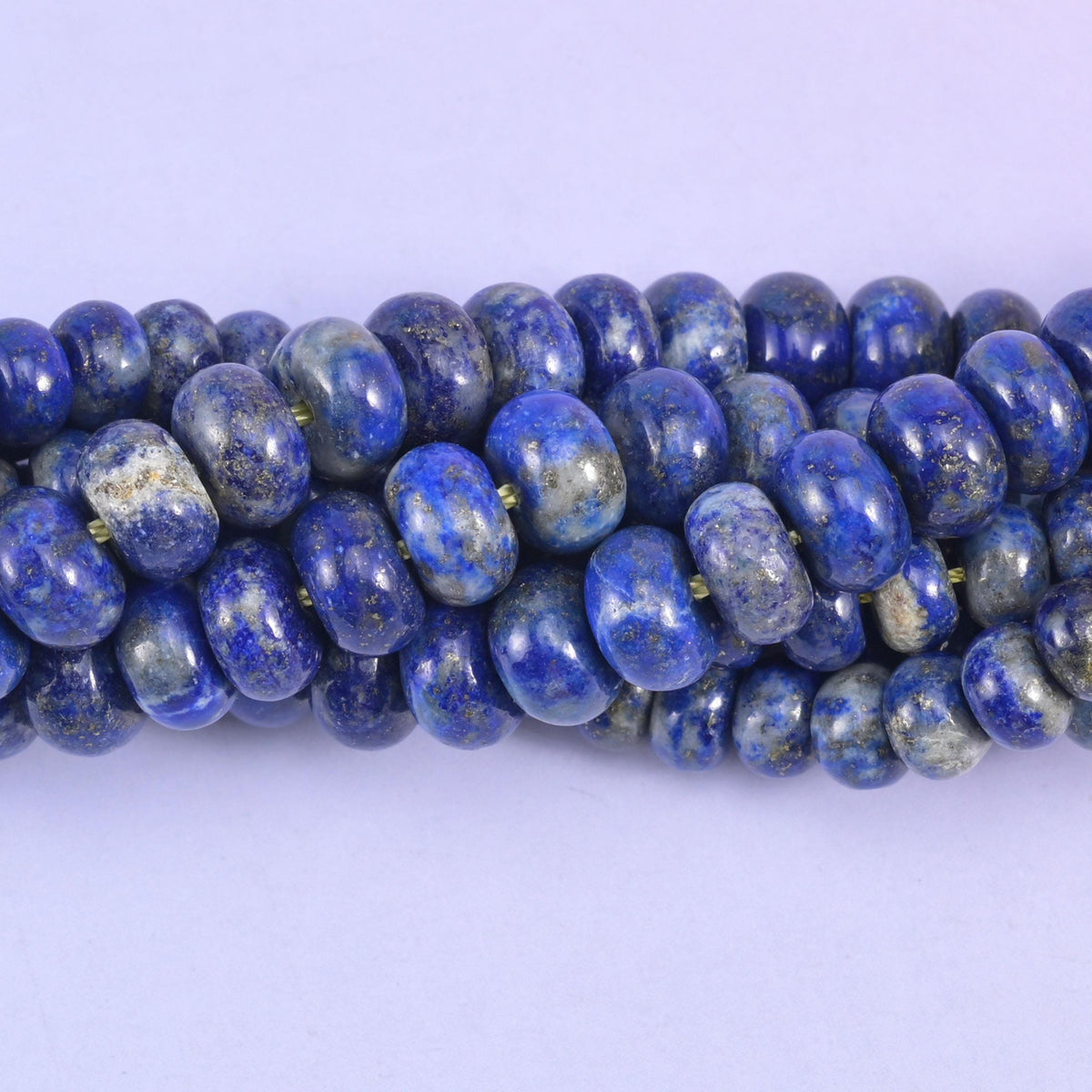 Rondelle cut Lapis Lazuli beads with a smooth polished finish