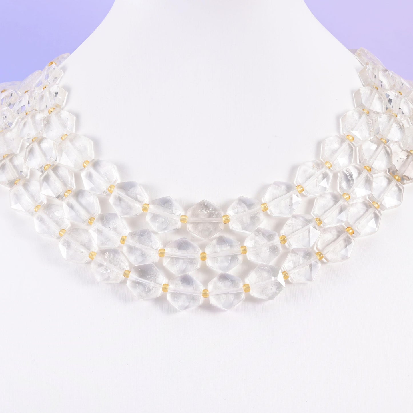 Clear quartz beads in icy near-colourless tones with soft white veils
