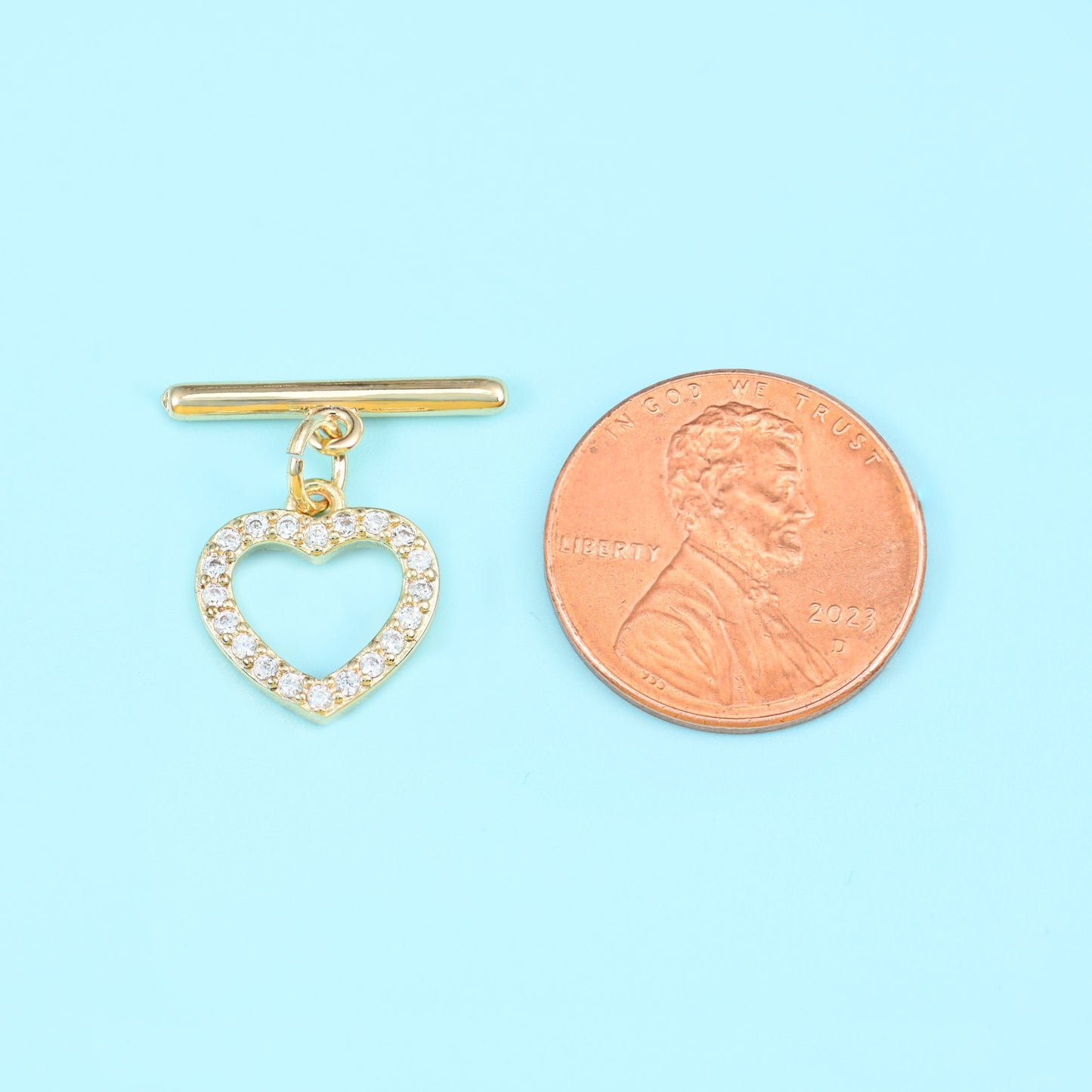 Heart shaped toggle clasp with 18K gold filled finish and set zircon stones