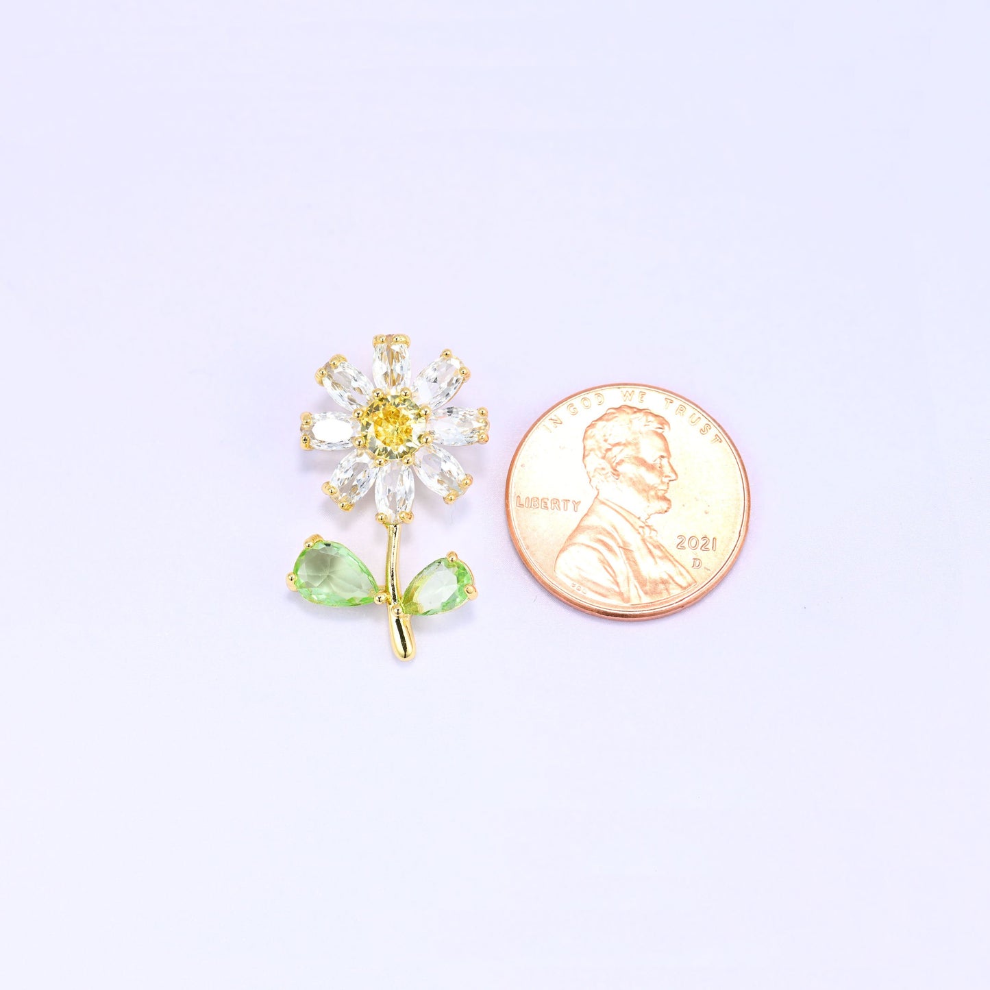 Brass daisy flower charm with sparkling zirconia accent