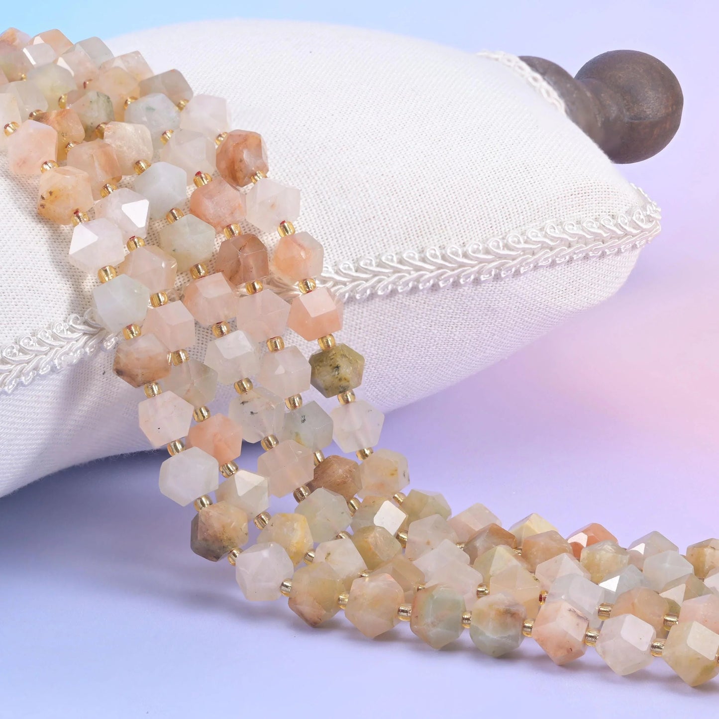 Red Grass Silk faceted diamond rhombus beads in soft apricot, peach, and oatmeal cream