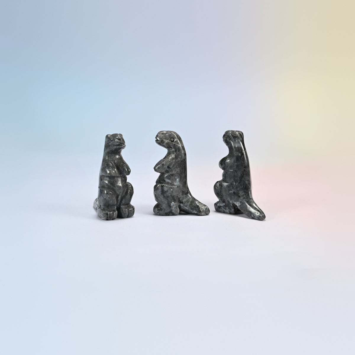 Three black labradorite T-Rex dinosaur crystal carvings, 2 inch, dark gray natural stone with light flecks