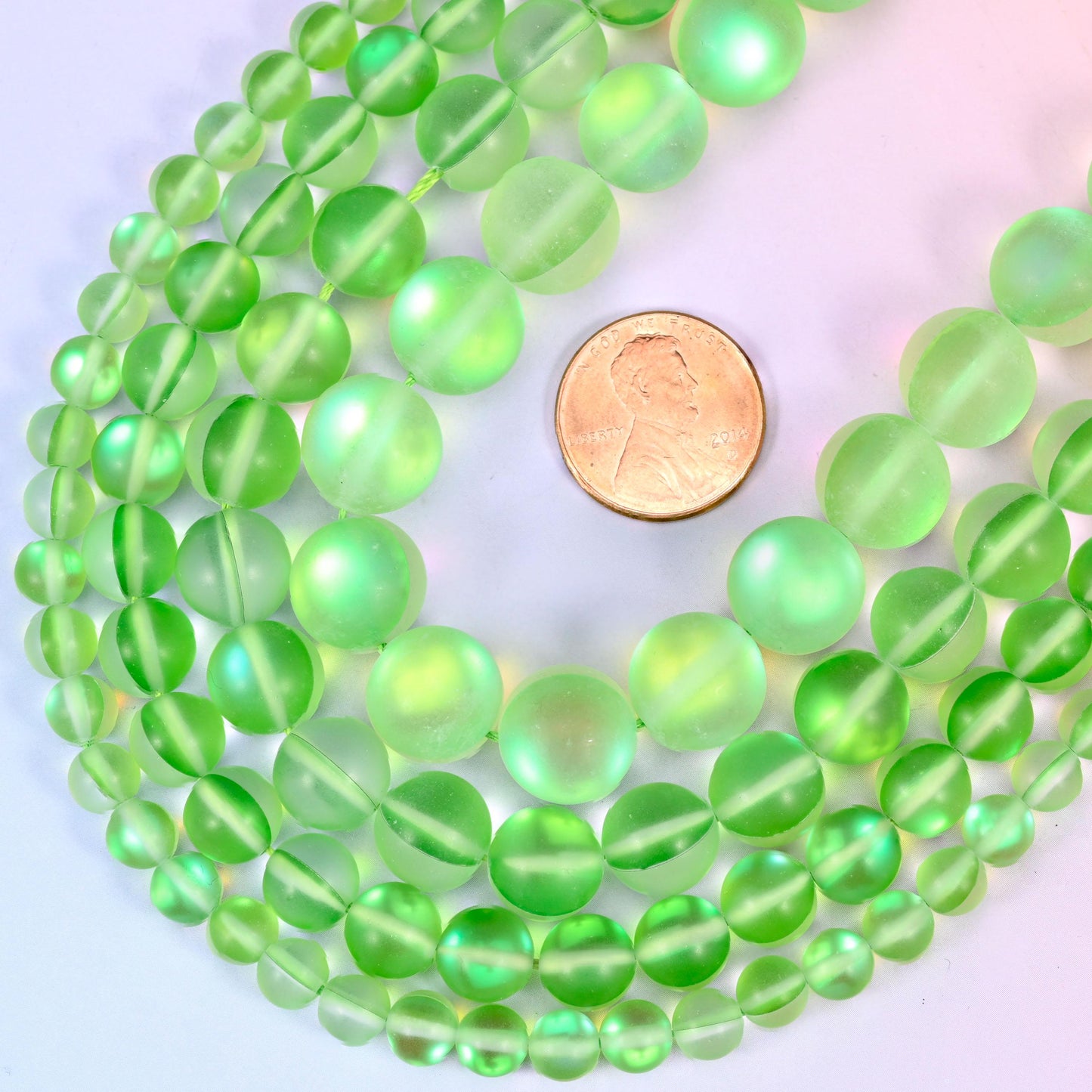 Round matte frosted light green glass beads with iridescent coating