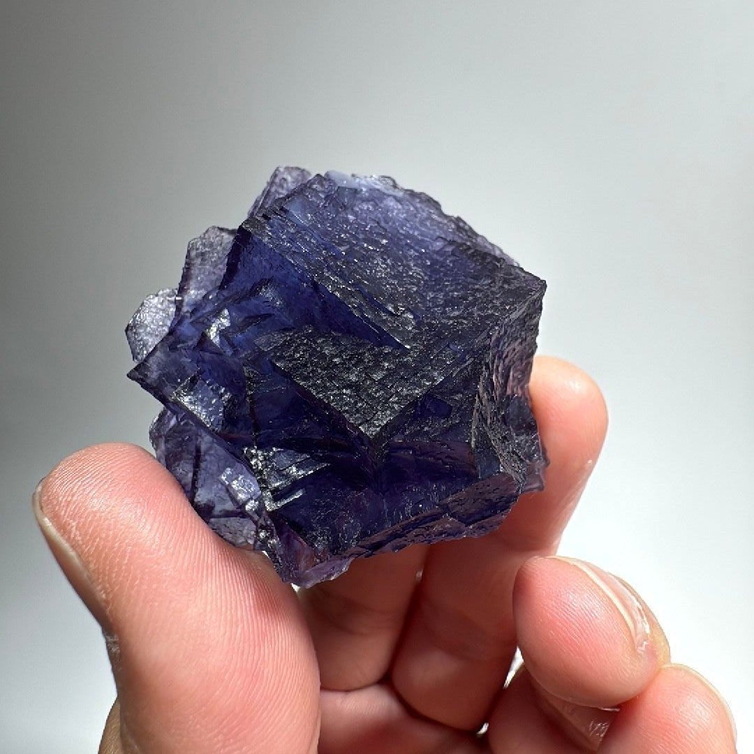 Purple blue cubic Fluorite specimen, interlocking stepped cubes in deep violet-blue
