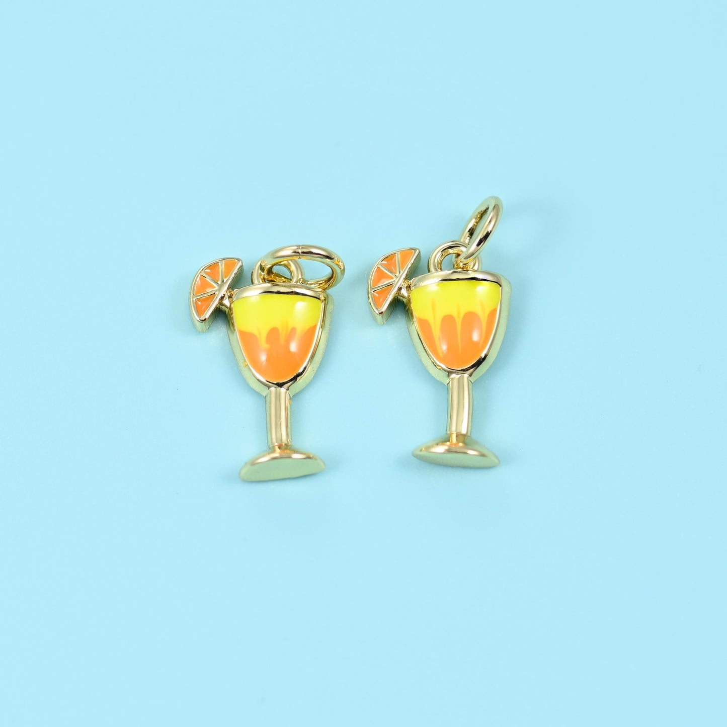 Cocktail glass with an orange slice cut brass beads